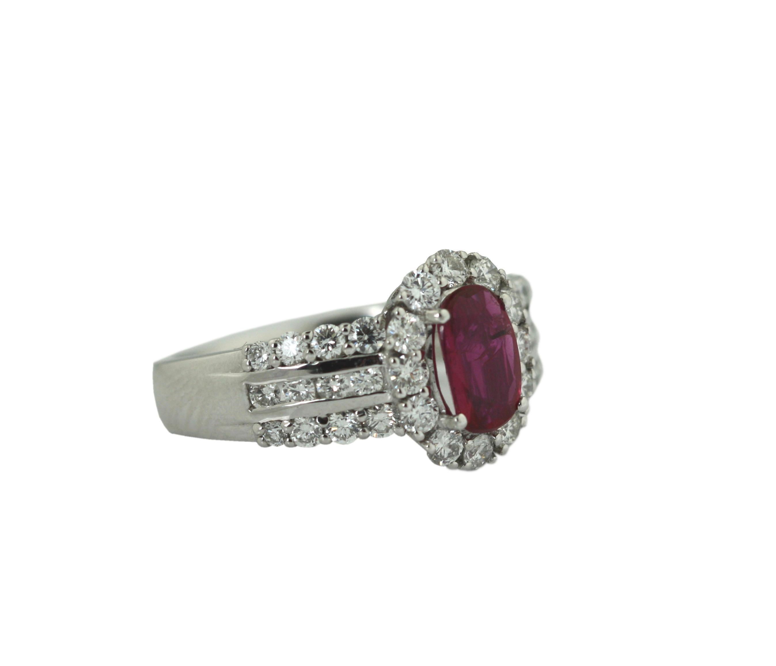 
Platinum, Ruby and Diamond Ring
Prong-set with a cushion-shaped ruby weighing 1.00 carats, framed by round diamonds, size 7.
﻿Accompanied by GIA report no. 6204910402, stating that the ruby has no indications of heating.
Accompanied with 
AIG
