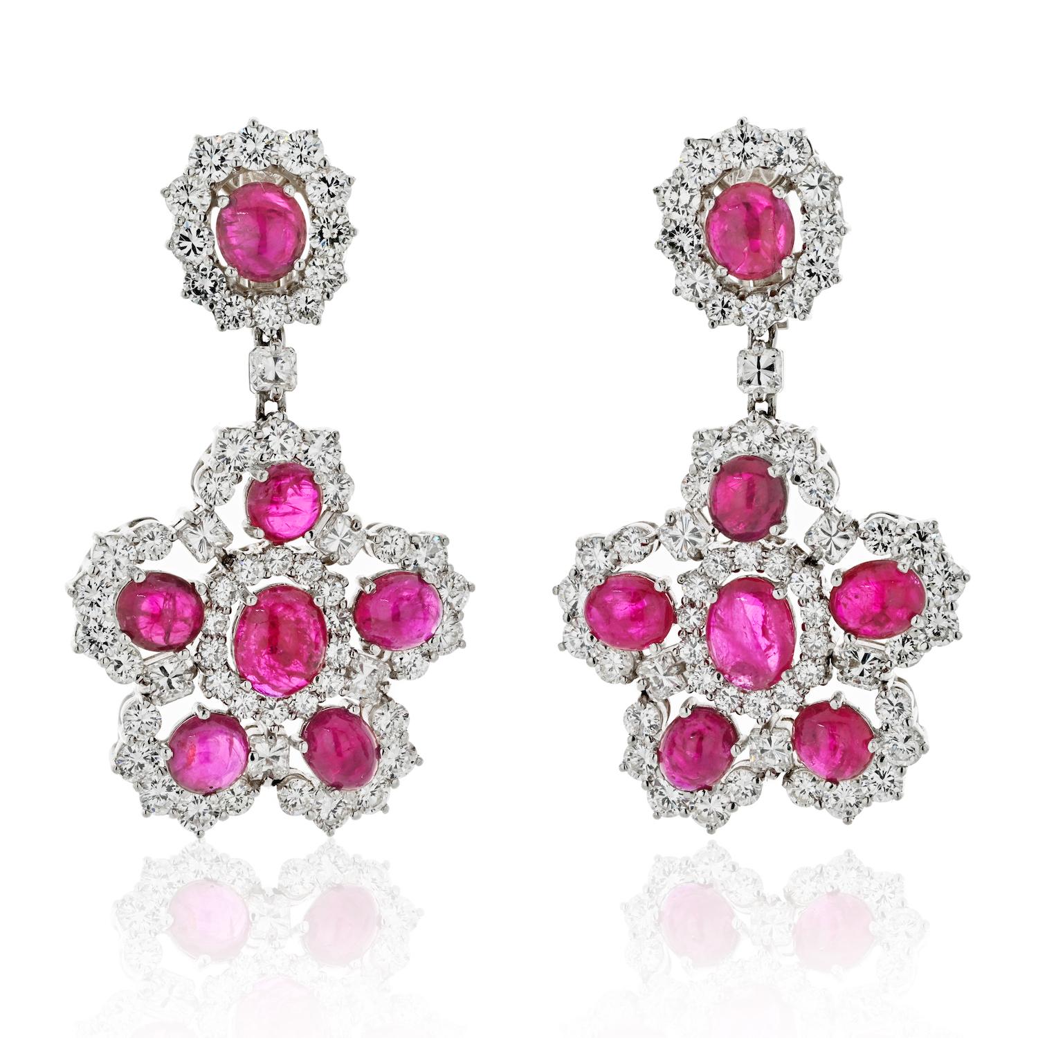 Platinum Ruby And Diamond Statement Dangling Earrings.

Diamond and ruby chandelier earrings in platinum are a stunning combination of precious stones and metal. The platinum setting provides a brilliant backdrop for the diamonds and rubies, which