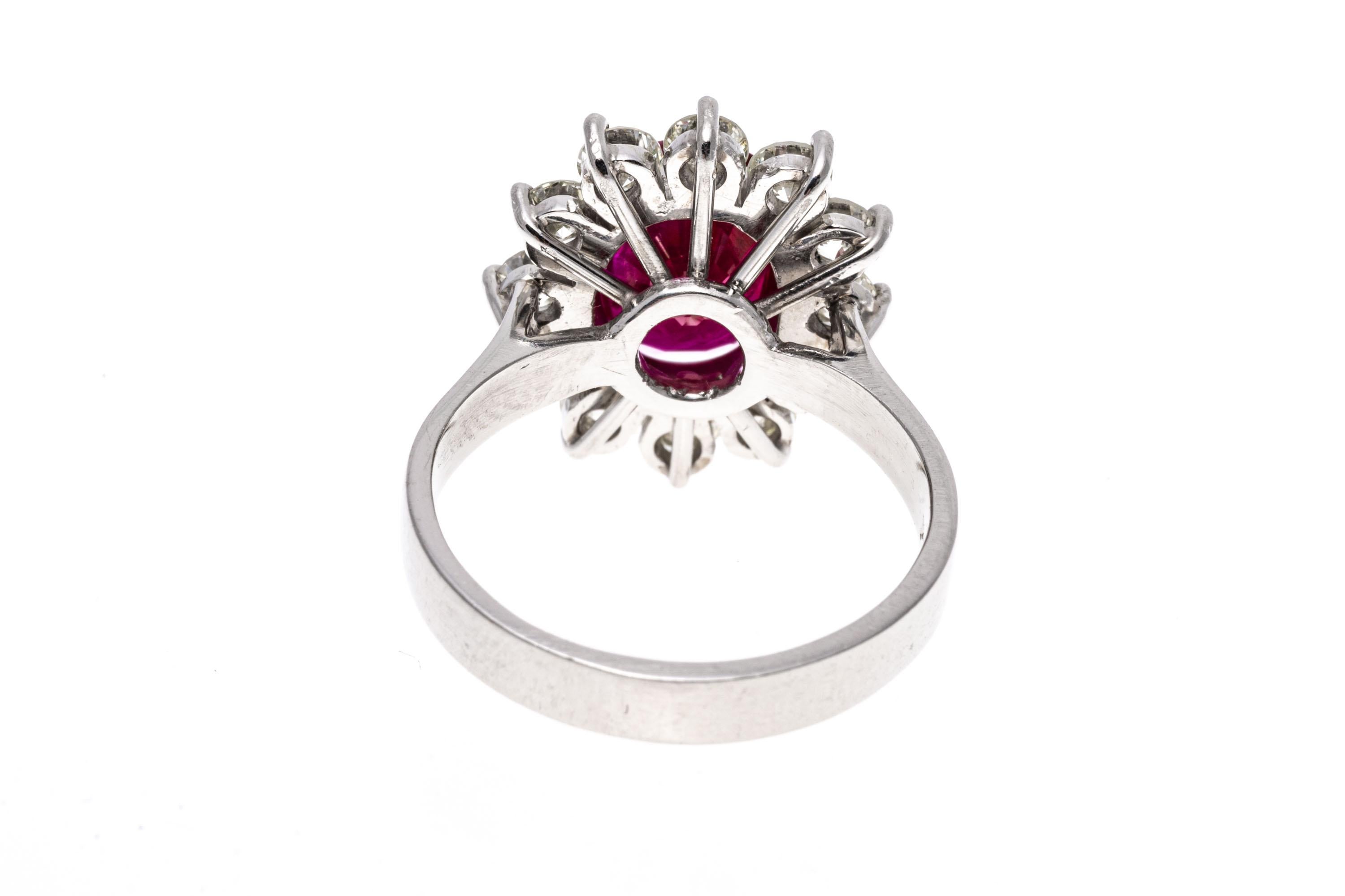 Round Cut Platinum Oval Ruby and Round Brilliant Diamond Halo Ring, App. 0.96 TCW For Sale
