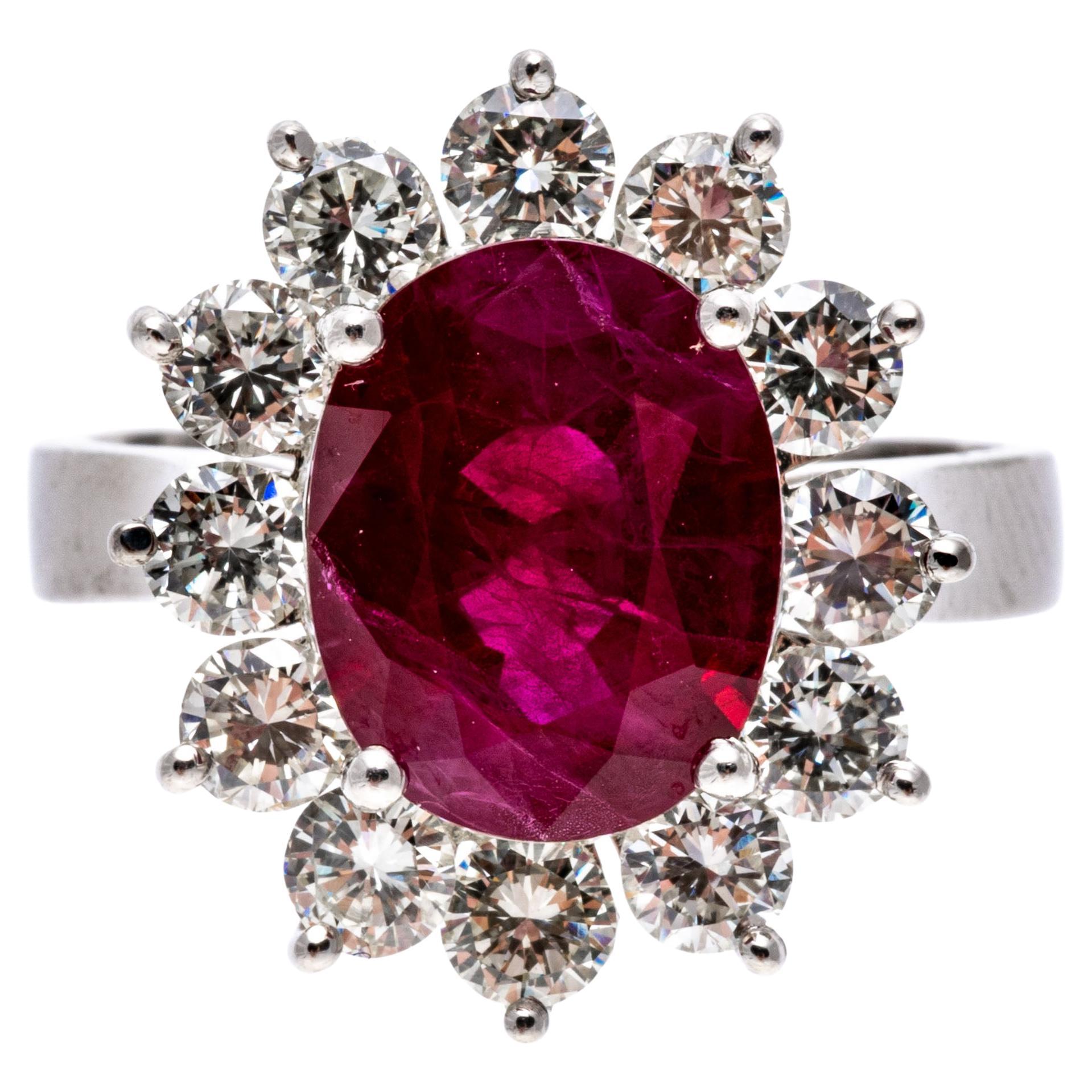 Platinum Oval Ruby and Round Brilliant Diamond Halo Ring, App. 0.96 TCW For Sale