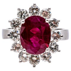 Vintage Platinum Oval Ruby and Round Brilliant Diamond Halo Ring, App. 0.96 TCW