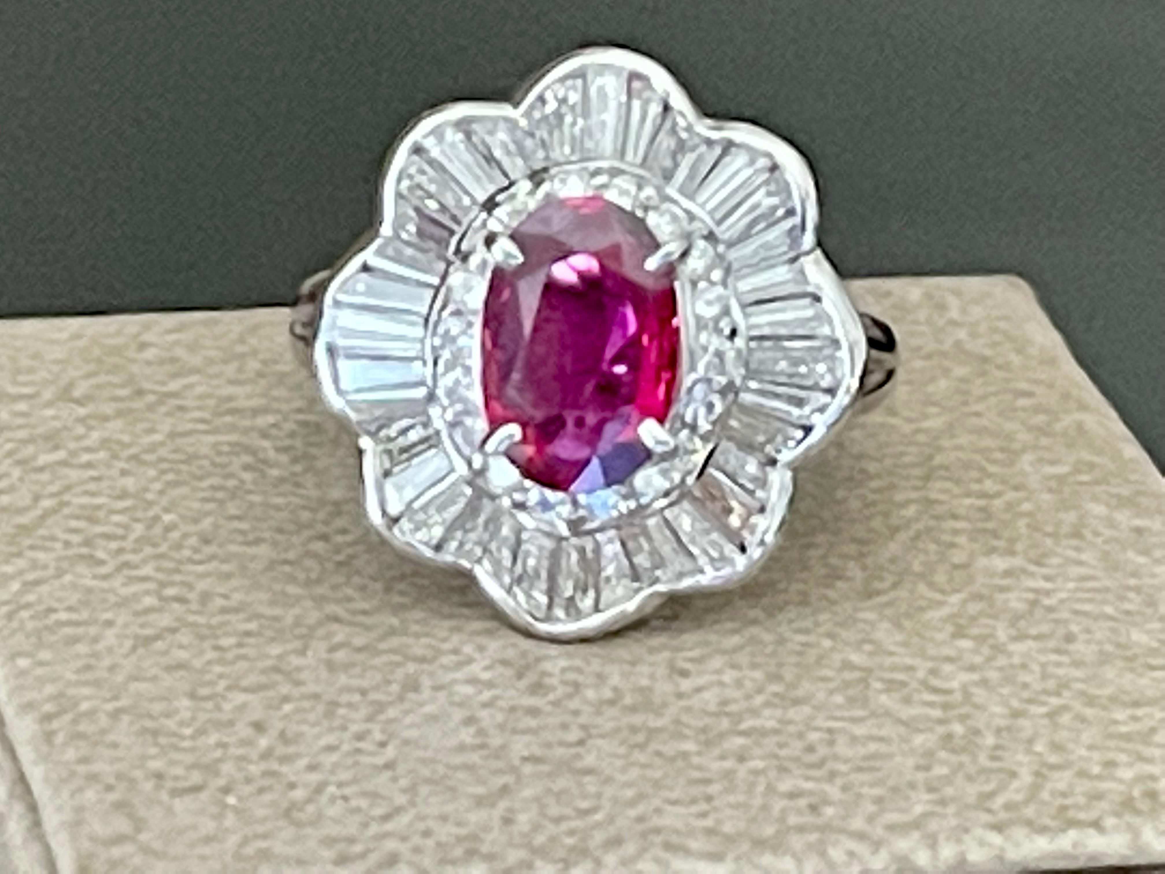 Timeless Platinum 850 Entourage Ring with an oval claw set Ruby weighing approximately 1.18 ct surrounded by tapered Baguette Diamonds and brilliant cut Diamond with an estimate weight of 1.23 ct , G color vs2 clarity.
The ring is currently size