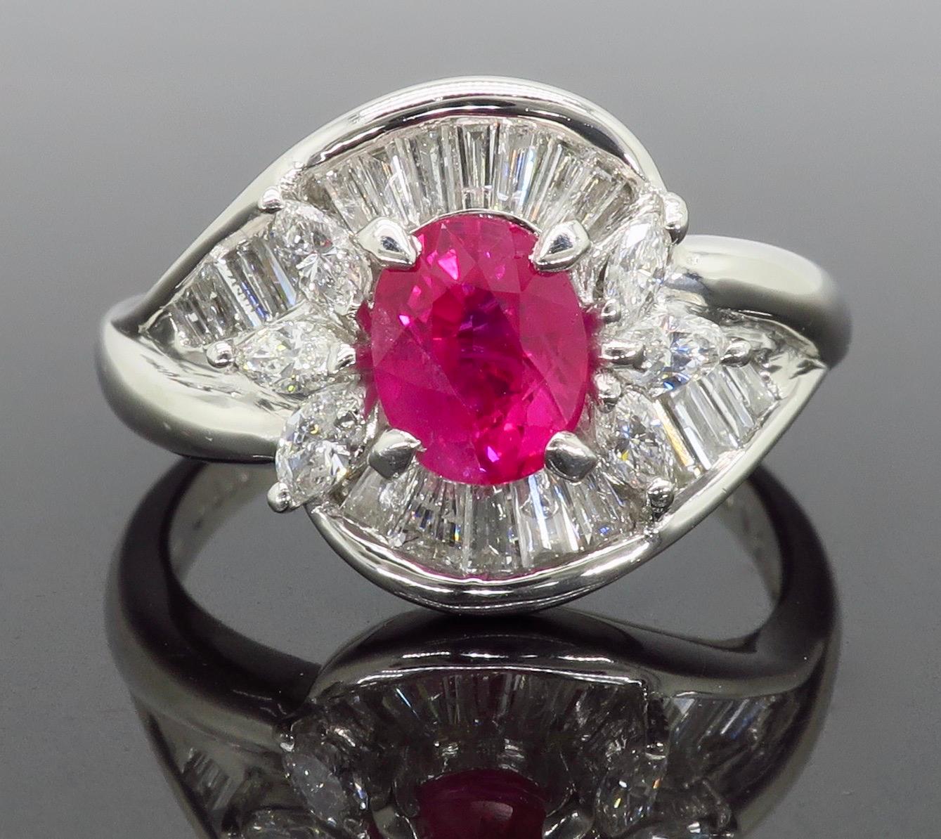 Oval Cut Platinum Ruby and Diamond Halo Ring