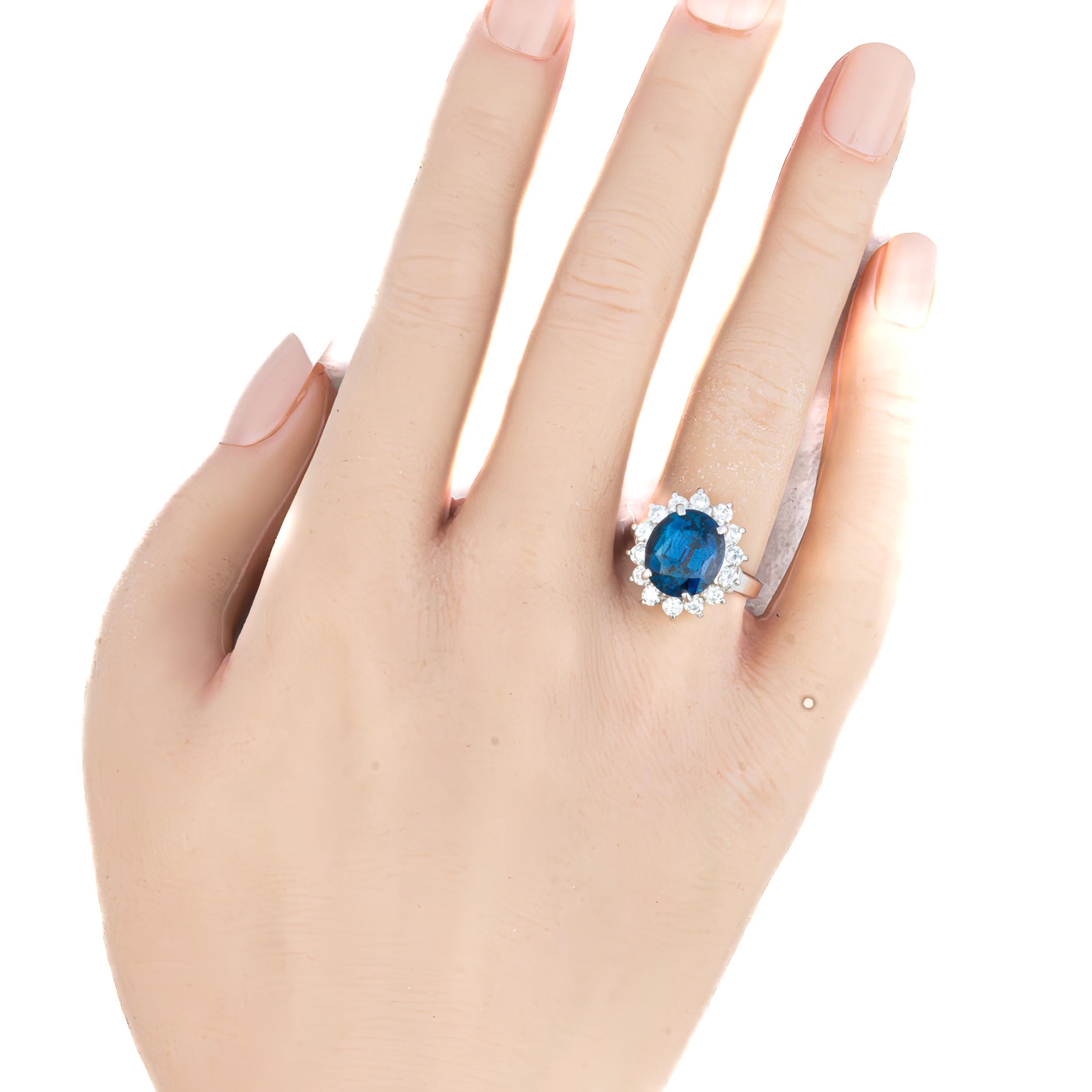 in vendita:  Anello aureola in platino con zaffiro e diamante 5