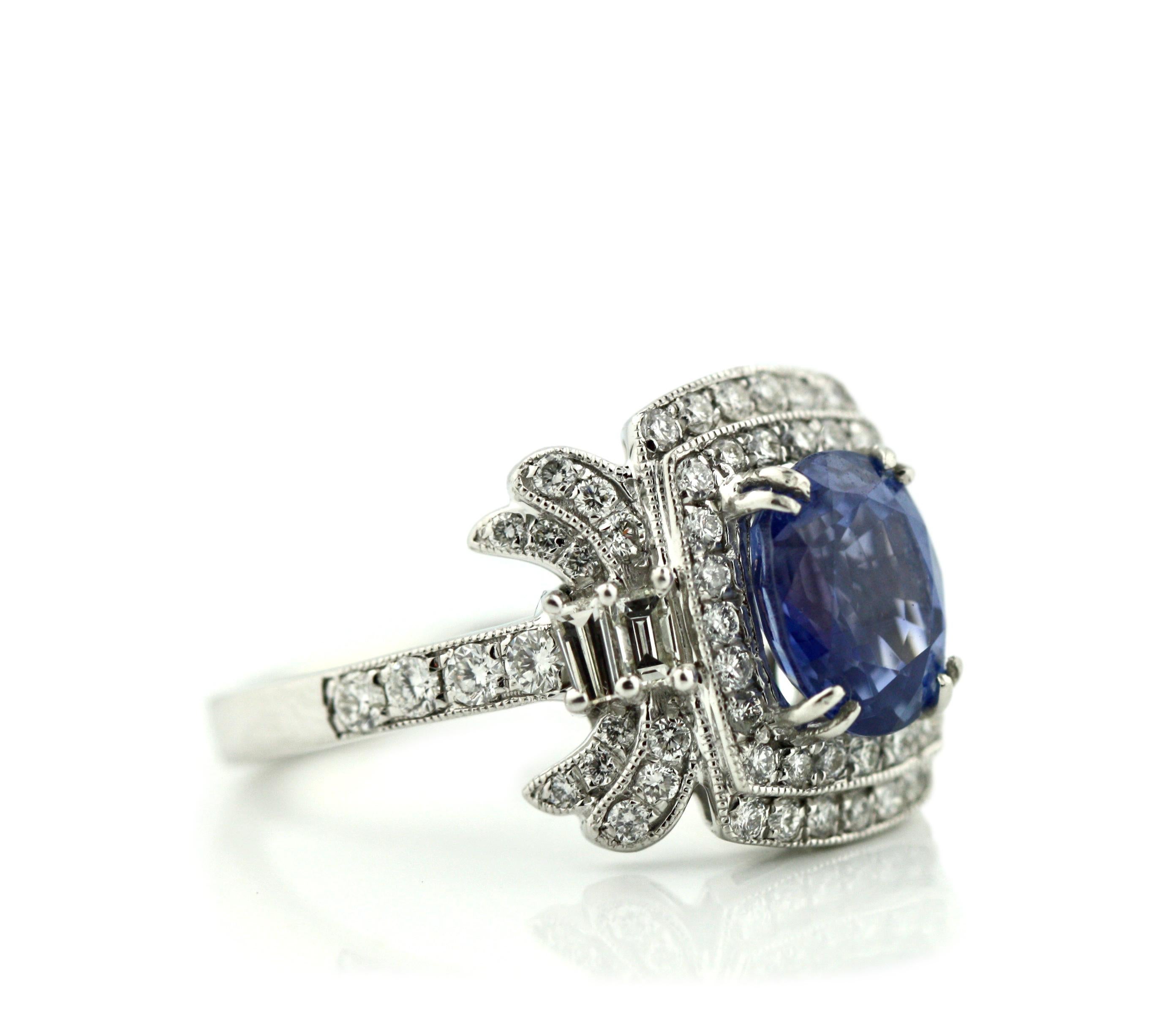 Platinum, Sapphire and Diamond Ring
Sapphire weighing approximately 2.61 carats
Diamonds weighing approximately 0.90 carats
size 7 1/2