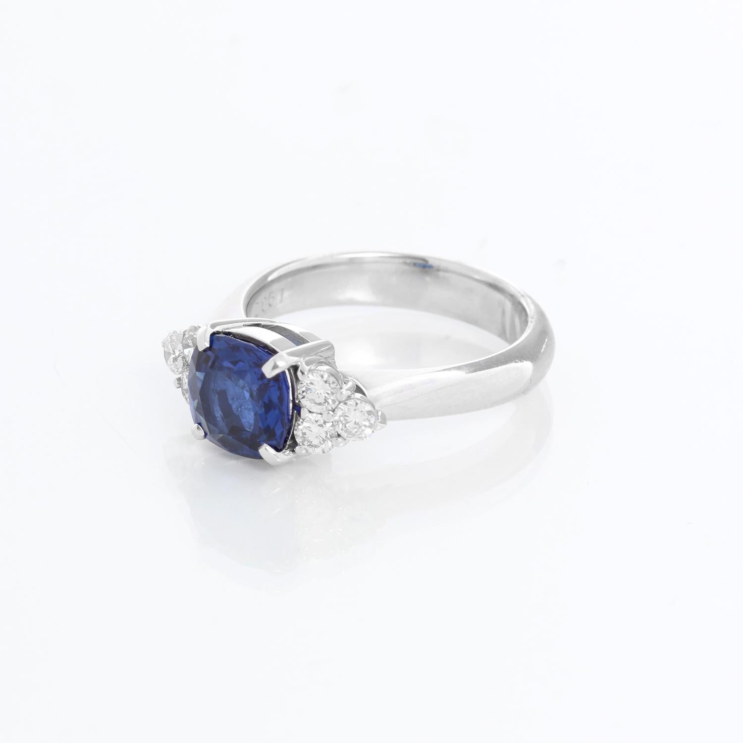 Platinum Sapphire and Diamond Ring Size 7 1/4 - Cushion shaped Sapphire weighing 2.34 cts. surrounded by .51 cts of diamond set in platinum. Total weight 9.2 grams. Hallmarked .