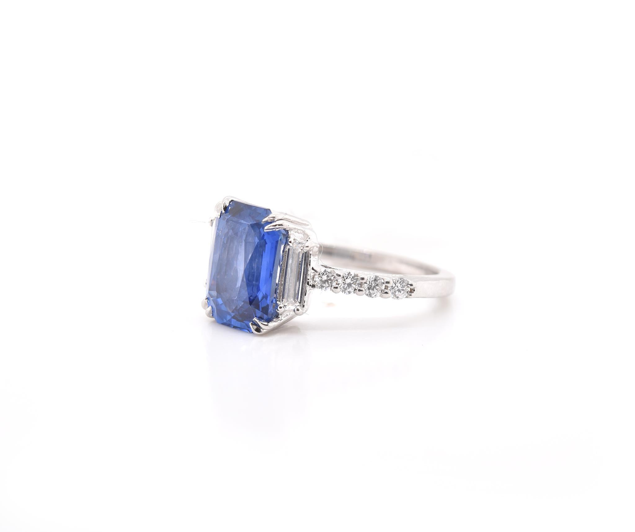 Designer: custom
Material: platinum
Sapphire: 1 radiant cut sapphire = 4.02cttw
Diamonds: 2 baguette and 8 round brilliant cuts = 0.70cttw
Size: 6 (please allow two additional shipping days for sizing requests)  
Dimensions: ring top measures