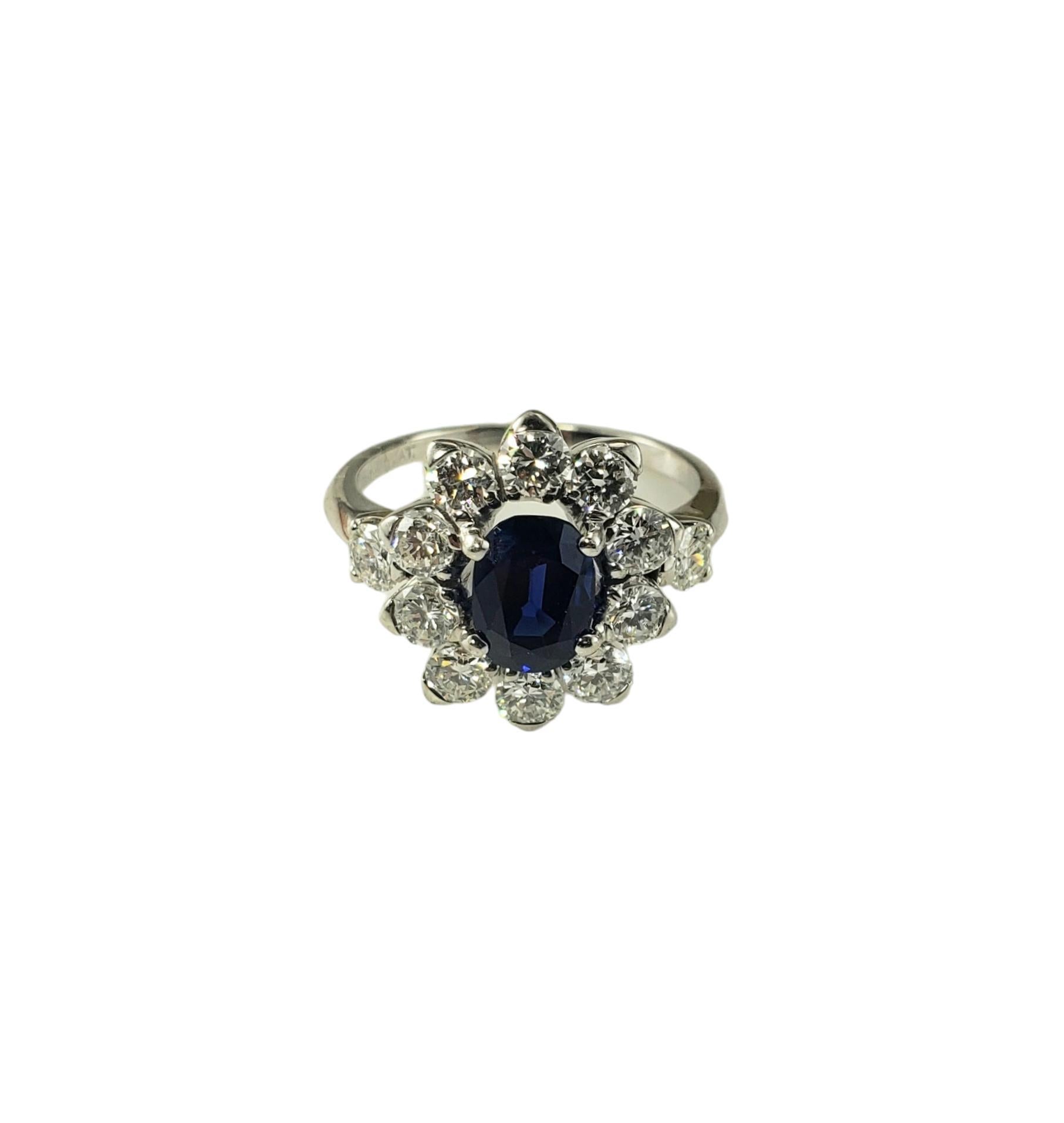 Platinum Sapphire and Diamond Ring Size 5.75 JAGi Certified-

This stunning ring features one oval natural blue sapphire (7.3 mm x 5.4 mm) surrounded by 12 round brilliant cut diamonds set in classic platinum. 

Width: 15 mm. Shank: 1.5