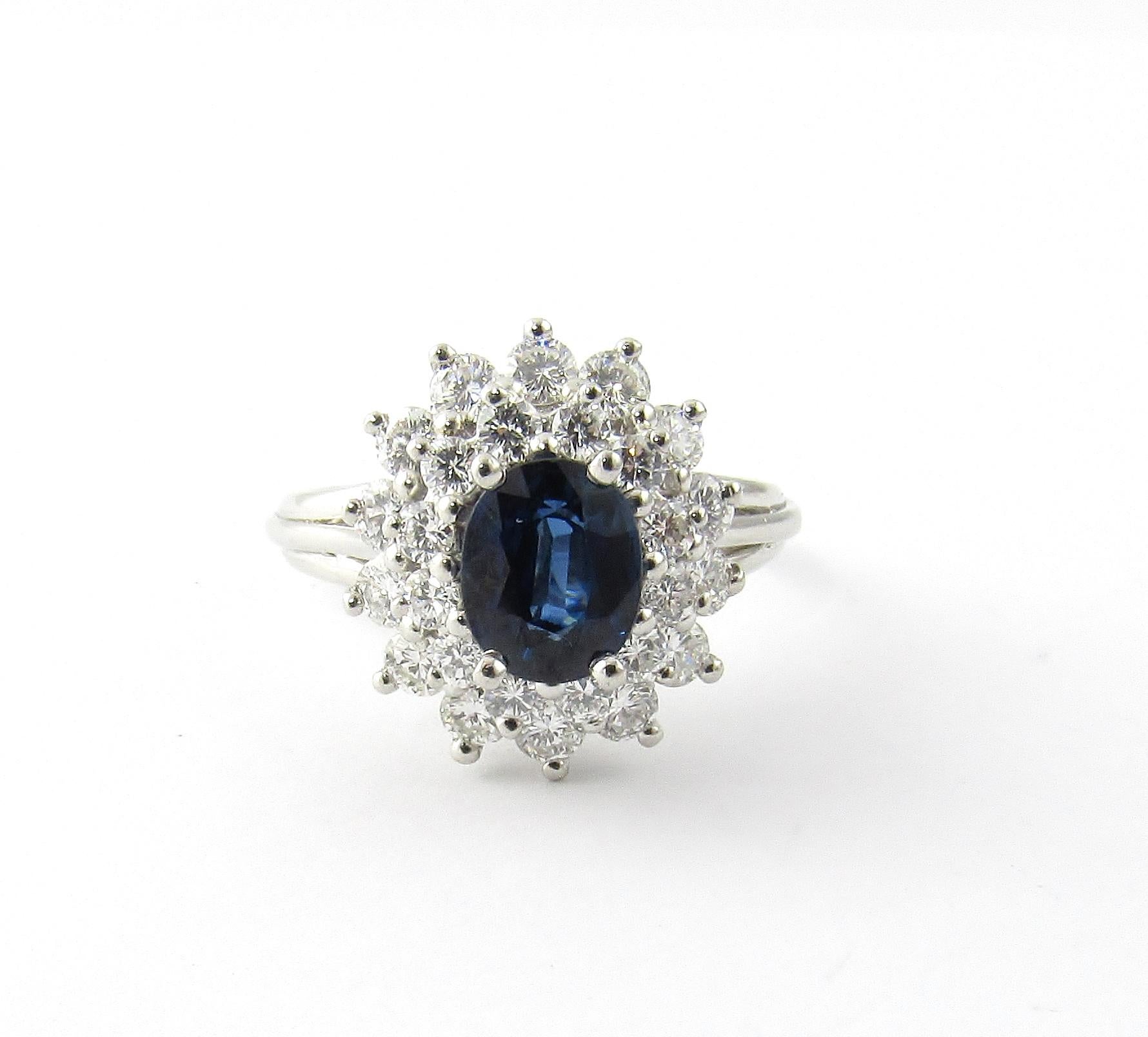 Vintage Platinum Natural Sapphire and Diamond Ring Size 6.75-

This stunning ring features one oval blue sapphire (7 mm x 6 mm) surrounded by 26 round brilliant cut diamonds and set in beautifully detailed platinum.  

Top of ring measures 15 mm x