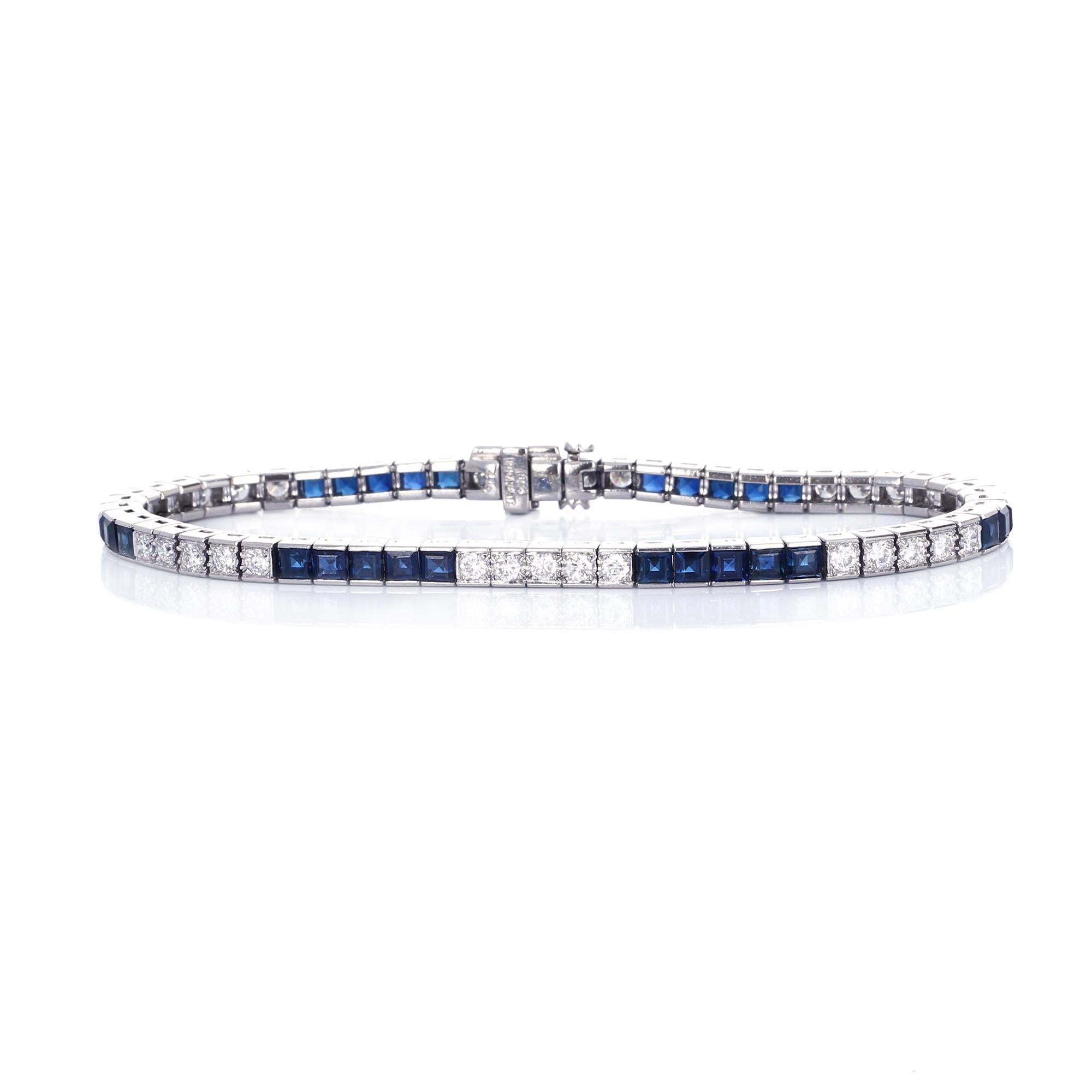 Platinum sapphire and diamond straight line retro bracelet. The bracelet is composed of princess cut sapphires and round brilliant white diamonds. There are 30 diamonds weighing 1.80 carats total weight
