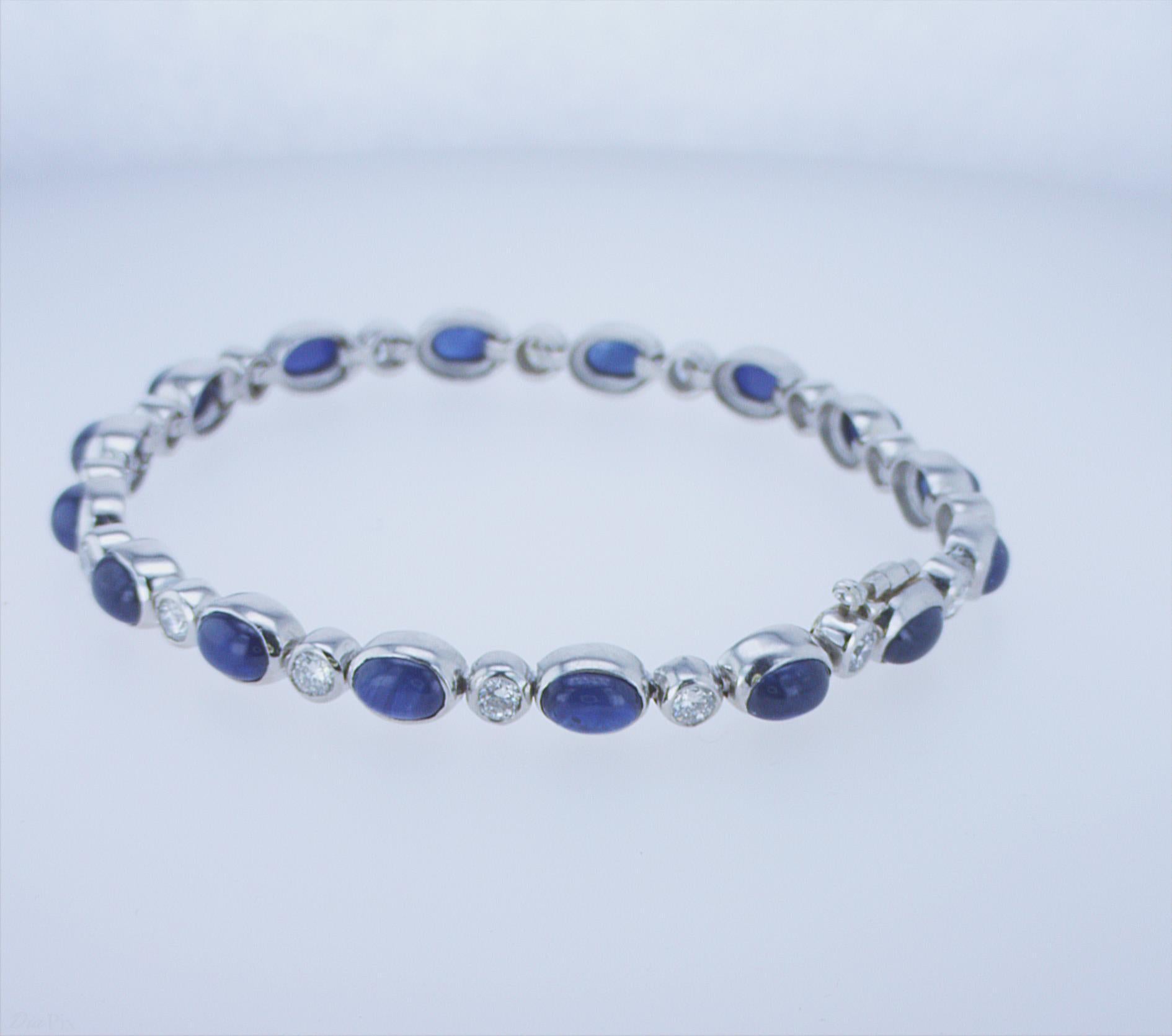 12.40ct Total Weight of Cabochon Sapphires, with 1.60ct TW of Round Brilliant Diamond Accents. Platinum. Stock Length.
