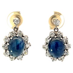 Orecchini in platino con zaffiro cabochon e diamante Rosetta