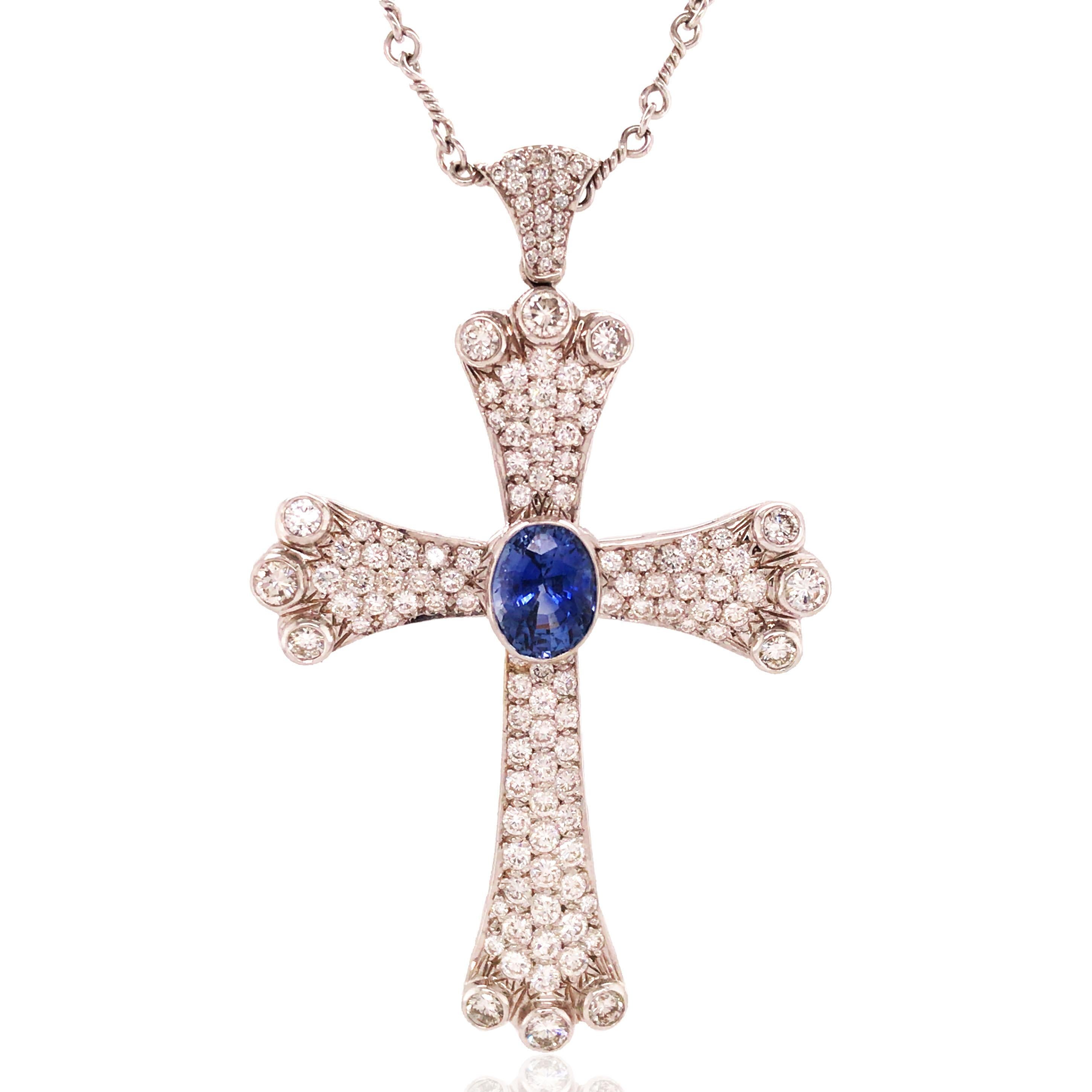 This sapphire diamond cross pendant necklace is crafted in platinum. An oval-cut sapphire is decorated in the center, surrounded by 124 round-cut diamonds. Sapphire approx. 7.3ct and diamond approx. 7.2ct in total.

Sapphire: 7.3ct
Diamond: