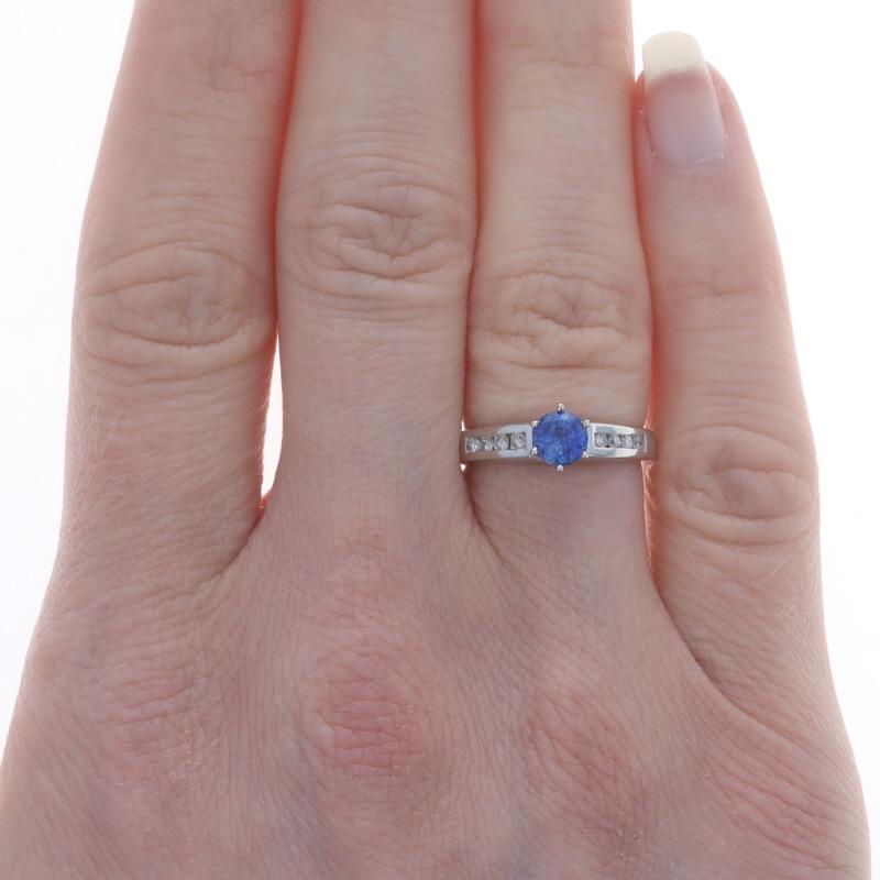 Size: 5
Sizing Fee: Up 2 sizes for $50

Metal Content: 900 Platinum

Stone Information
Natural Sapphire
Treatment: Heating
Carat(s): .57ct
Cut: Round
Color: Blue

Natural Diamonds
Carat(s): .20ctw
Cut: Round Brilliant
Color: G - H
Clarity: SI1 -