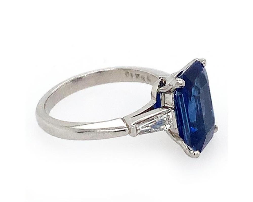 Platinum sapphire diamond ring, emerald cut sapphire weighing 4.92 (known weight) two tappered baguette weight 0.50 cts, GH VS, stamps 35219 PLAT, ring size 6 1/4, weight 4.3 dwt