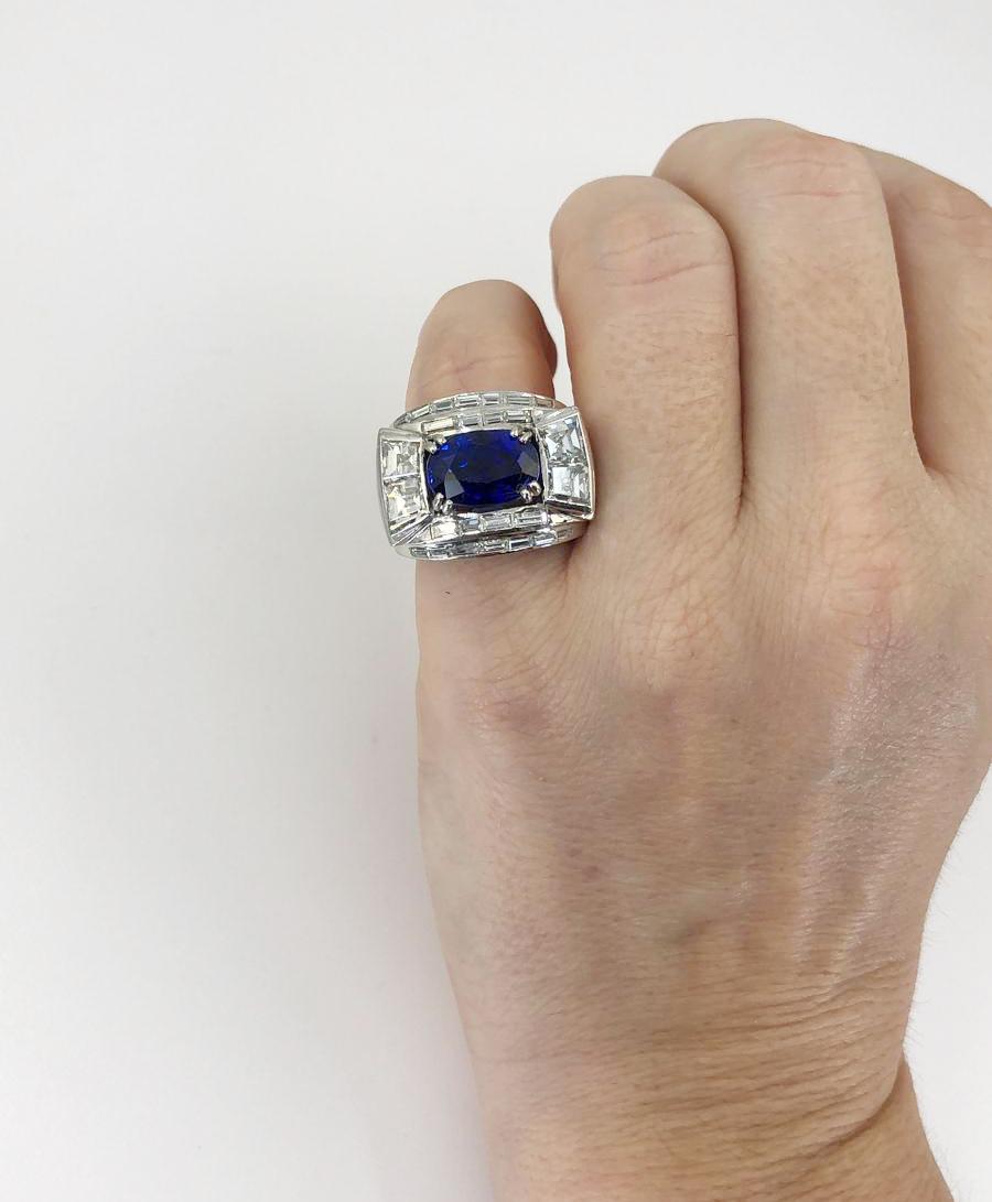Madagascar Sapphire Diamond Ring 5.51 cts in Platinum.

An east-west oval-shaped unheated sapphire from Madagascar with a gorgeous blue velvet color, set among step-cut white diamonds and bright white platinum, which both allow the colored gem to