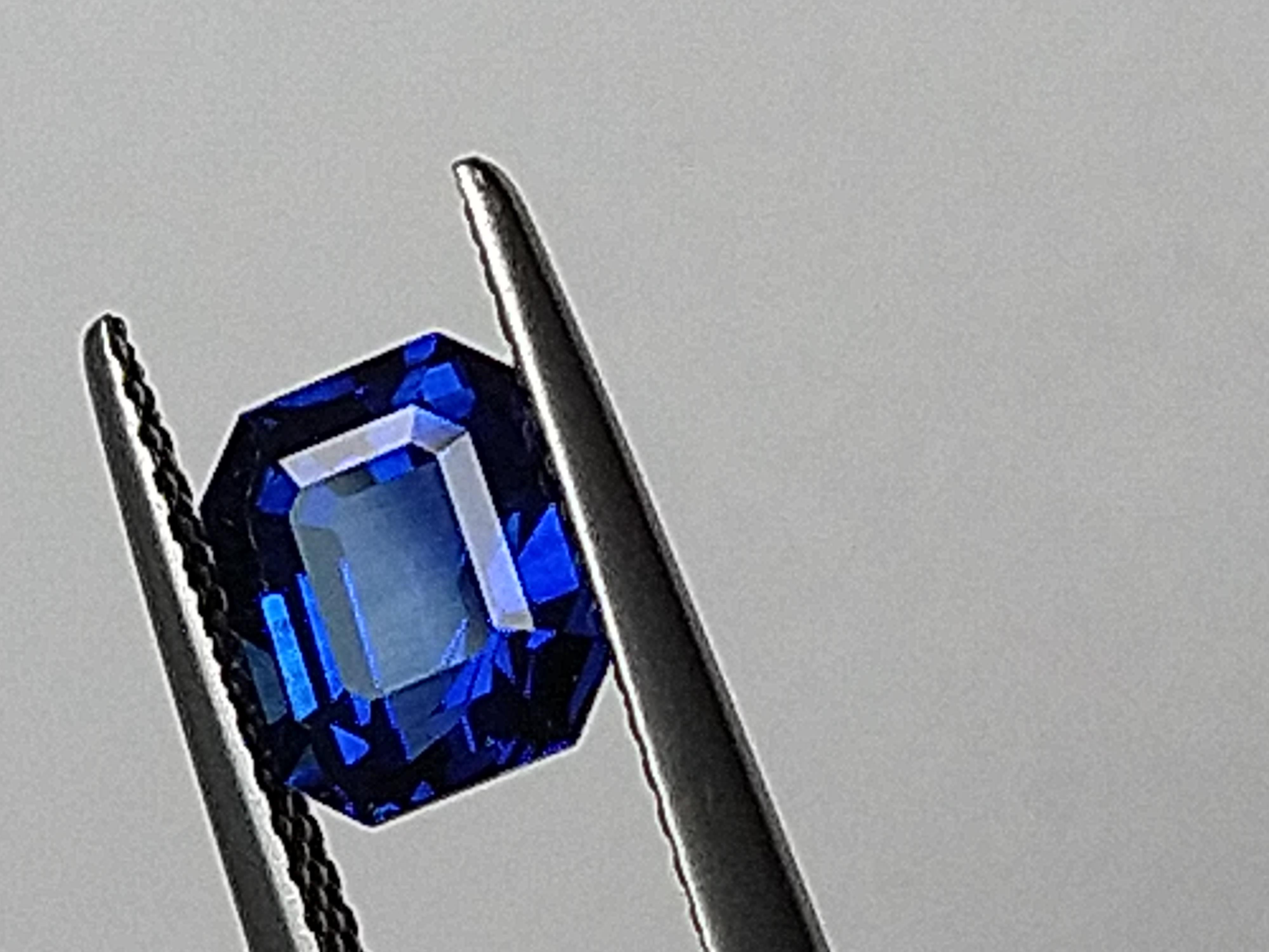 For Sale:  Platinum Sculpture Unisex Ring with 2.48 Carat Emerald Cut Blue Sapphire 12