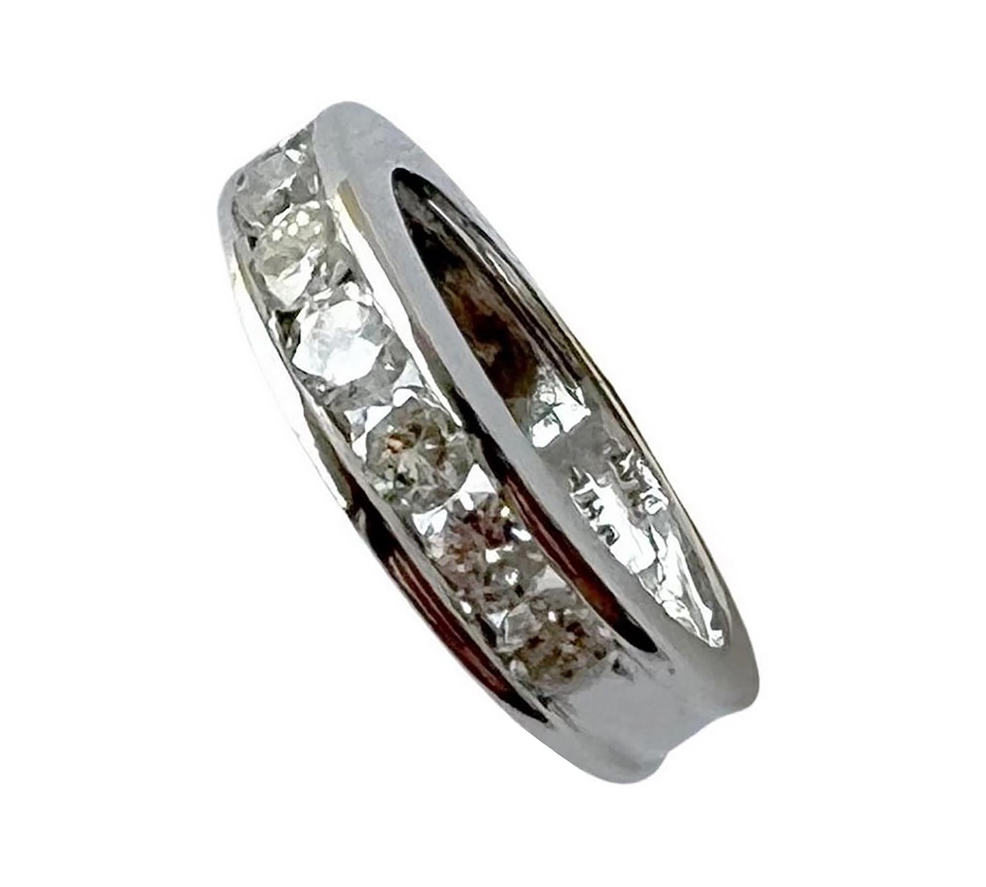 Stunning platinum and diamond semi eternity band ring circa 1990s. Ring is a finger size 6 and features seven icy white round diamonds channel set in a highly polished platinum half circle setting. The diamonds are round in shape, near colorless,