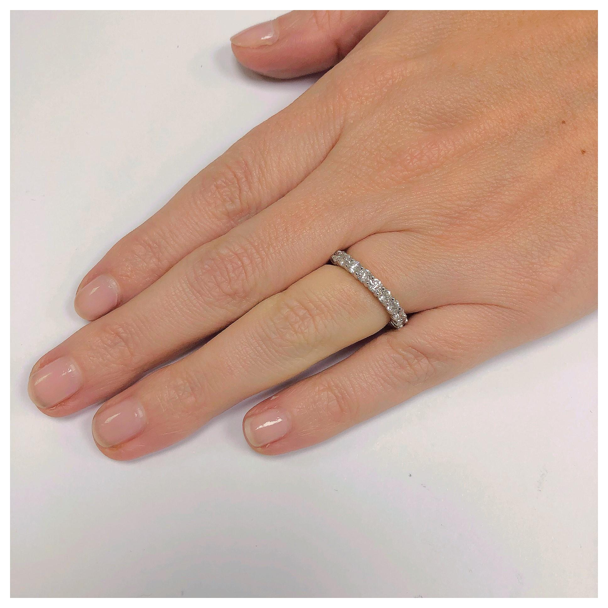 Beautiful shared prong eternity band in Platinum with 1.83 ct total weight of G color Si diamonds. It has an open gallery on the side and is a finger size 5. Not your finger size, we would gladly make one to fit! If you don't see something, say