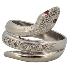 Bague serpent en platine 0,12 ct de diamant et 0,02 ct de rubis