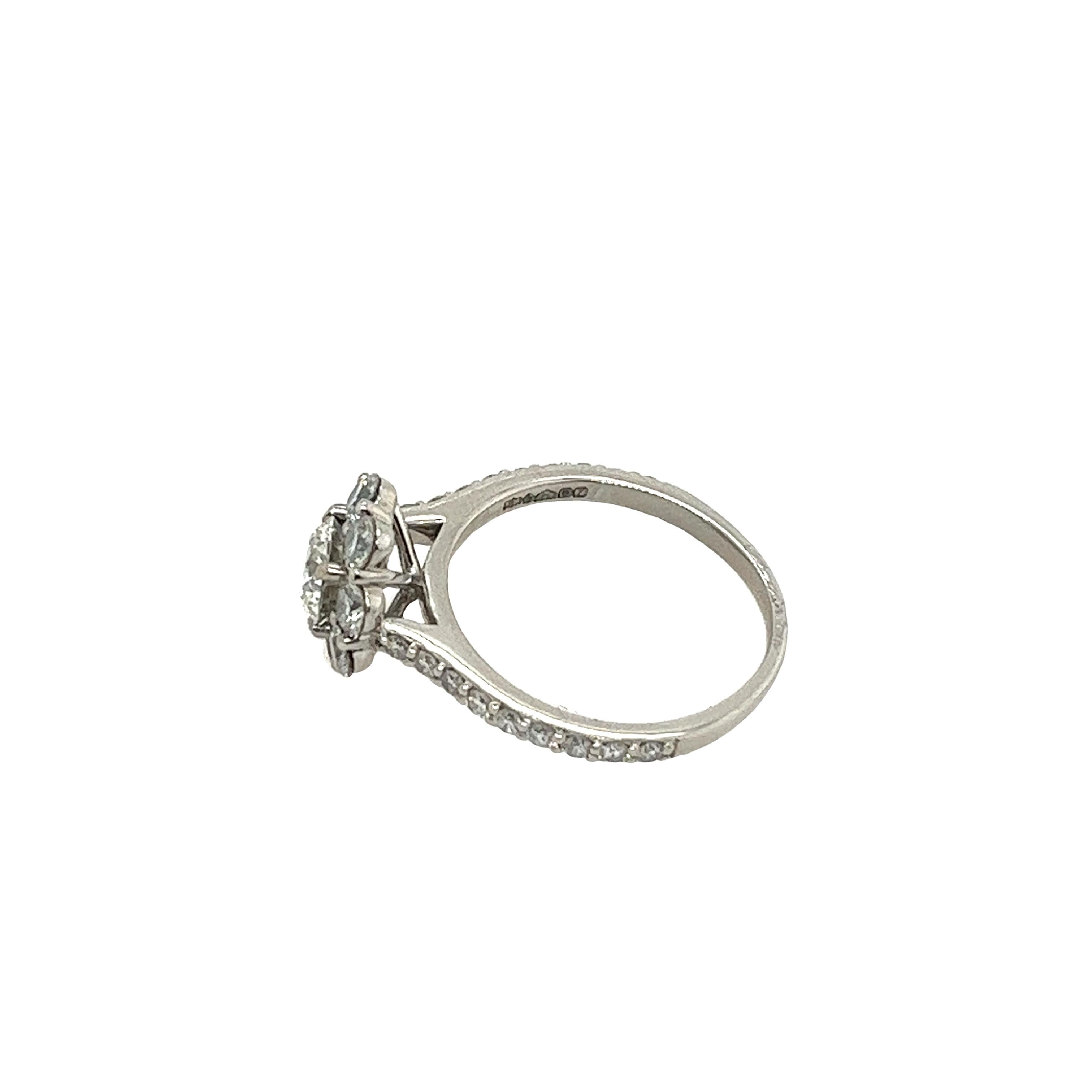 An elegant diamond ring for your engagement, 
set with 0.70ct H colour and SI2 clarity GIA certified
natural round cut diamond, 
surrounded by 8 round diamonds and 18 diamonds on the shoulders 
in a platinum setting.
A beautiful and elegant choice