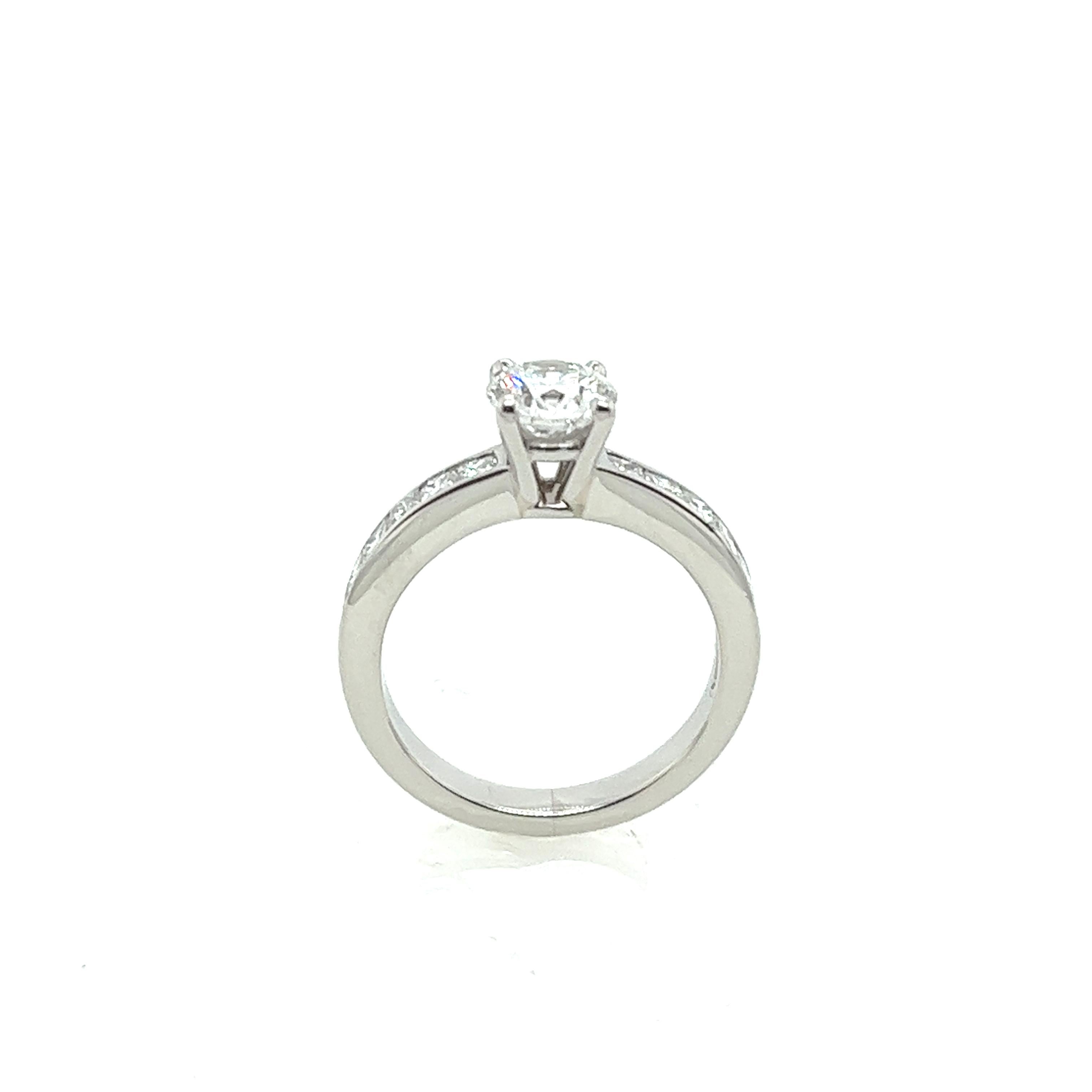 This Platinum solitaire diamond ring 0.70ct E colour, with an HRD certificate, is set with 12 princess cut diamonds on the shoulders totaling 0.36ct.

This ring is elegant and beautiful and will last as long as your love does.

Total Diamond Weight: