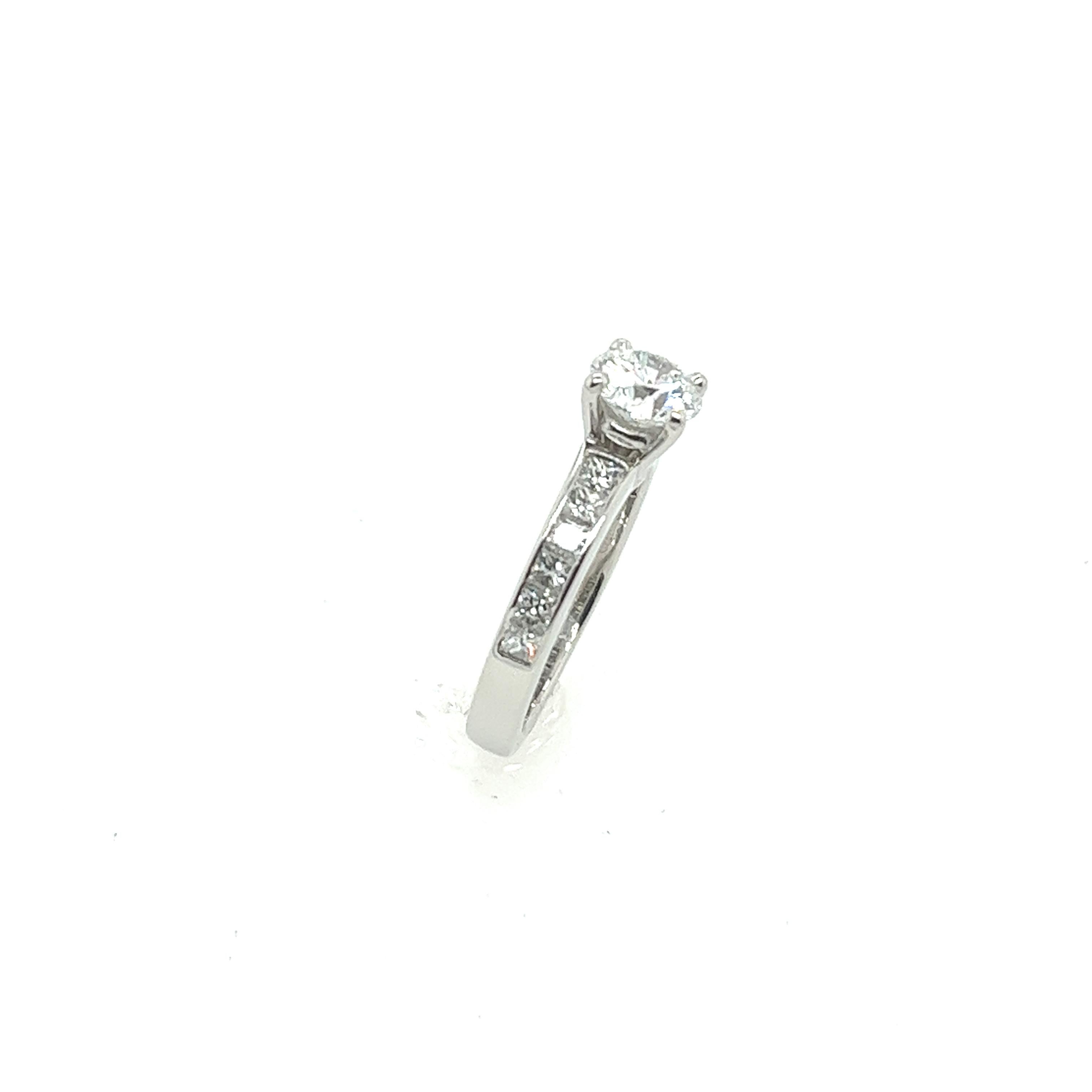 Platinum solitaire Diamond Ring 0.70ct E Colour, with 12 diamonds on shoulders 2