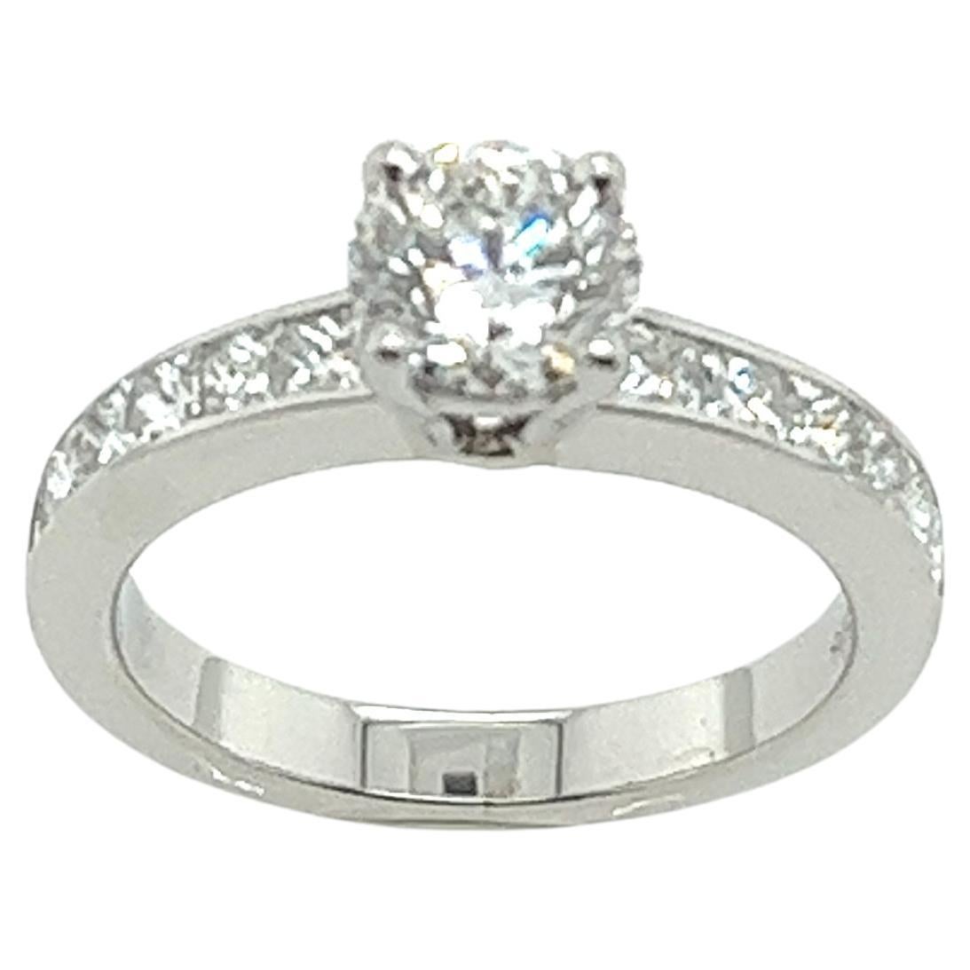 Platinum solitaire Diamond Ring 0.70ct E Colour, with 12 diamonds on shoulders