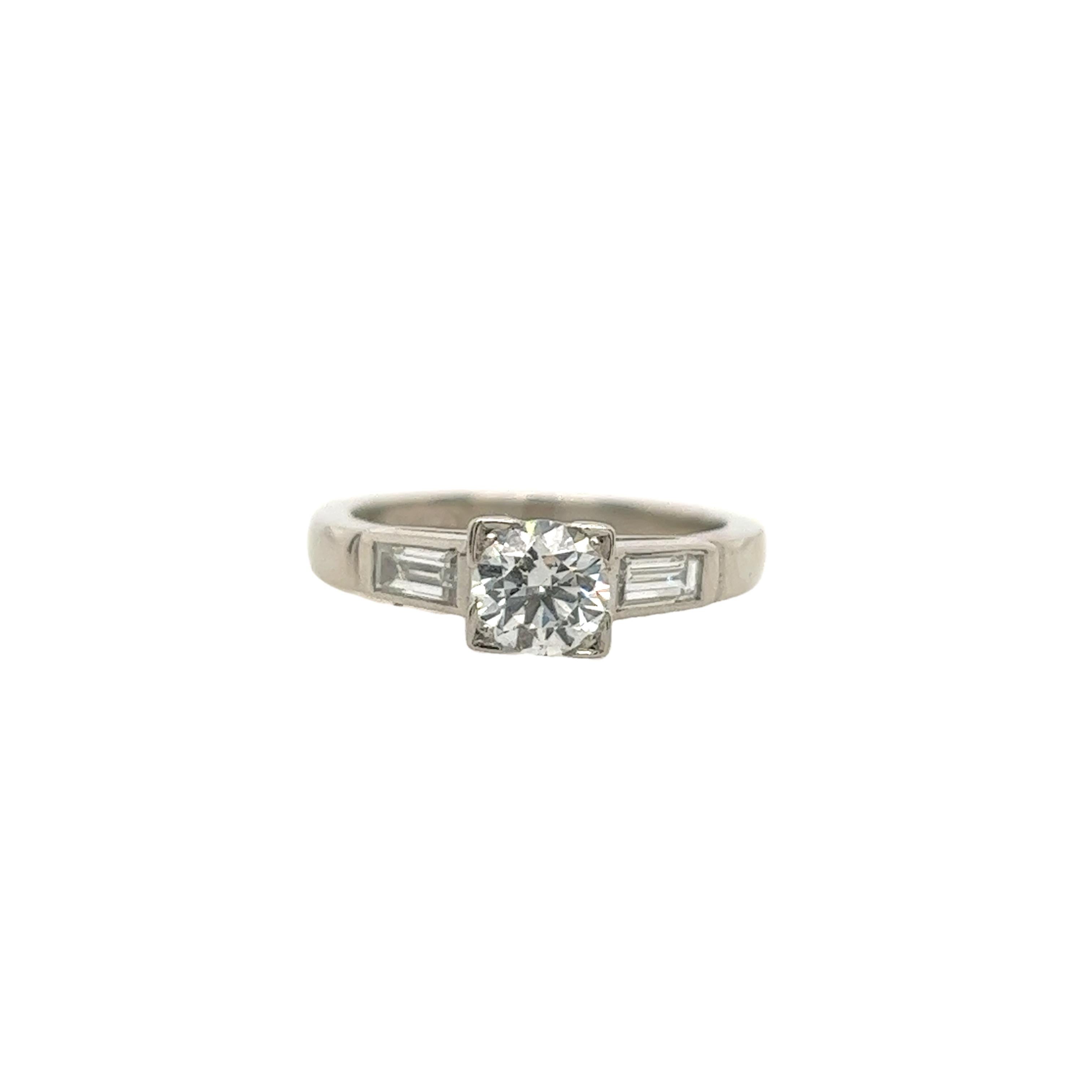 An elegant diamond ring for your engagement, set with 0.58ct G colour and SI1 clarity 
natural round cut diamond  with matching baguettes on shoulders in platinum setting.
A beautiful and elegant choice for an engagement ring or a special