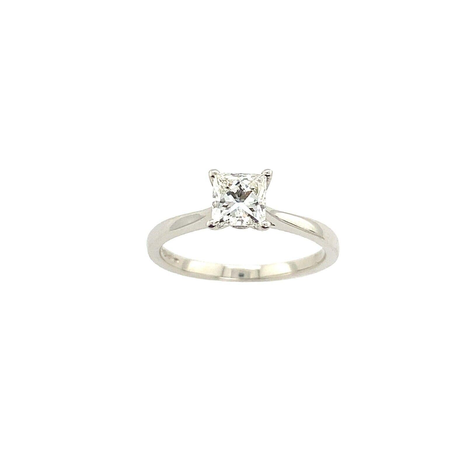 An elegant Diamond ring for your engagement, this Platinum ring features a 0.62ct Square Brilliant Cut Diamond. The VVS2 clarity, H colour diamond is set in a four-claw Platinum setting, with 2 small round Diamond on sides. The Diamond is certified