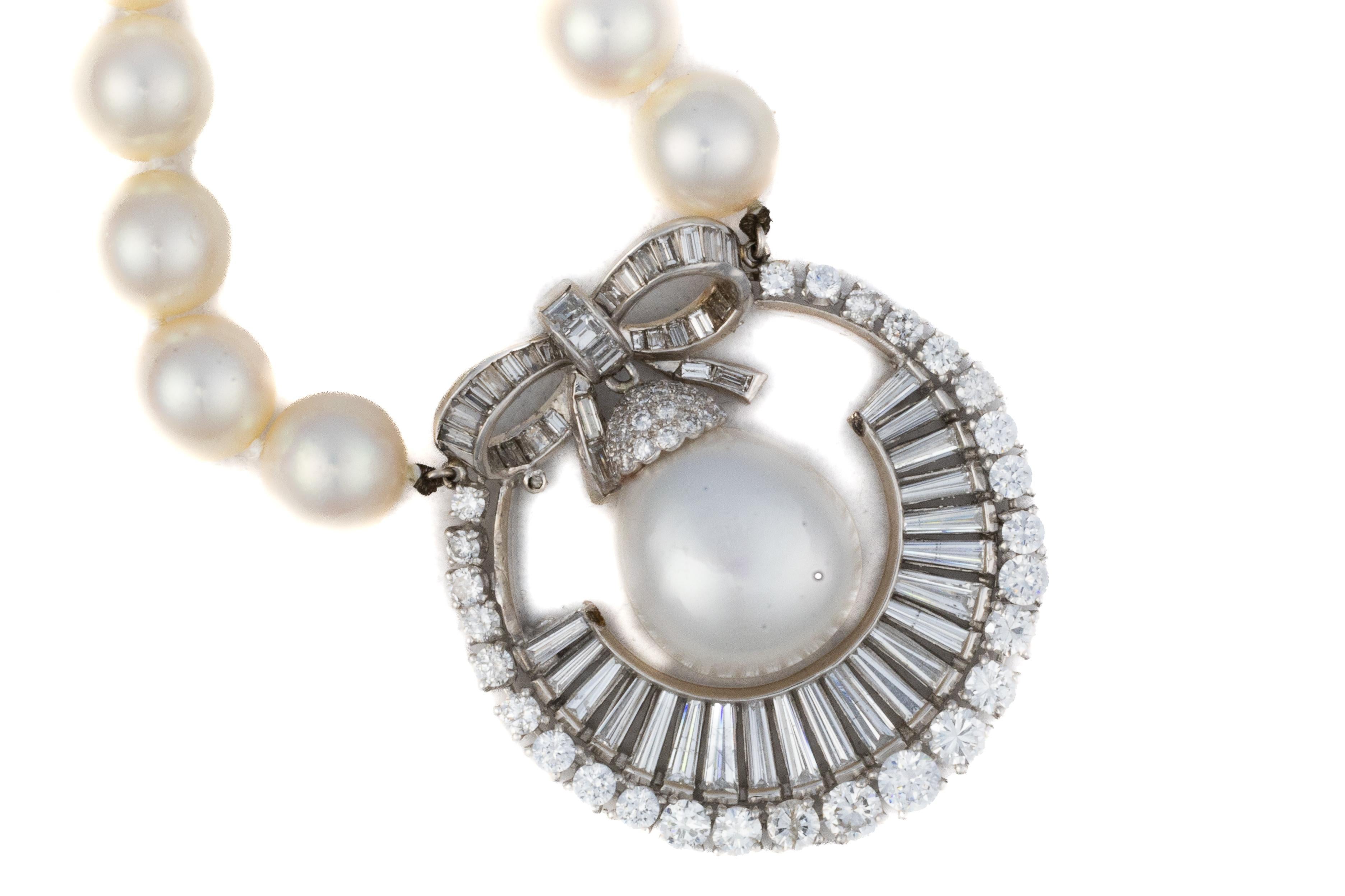 Platinum South Sea Pearl and Diamond Pendant Necklace

Description:
A graceful South Sea pearl necklace strung with luminous pearls and centered by an ornate pendant crafted in platinum. The pendant is designed with a large pearl drop framed by an