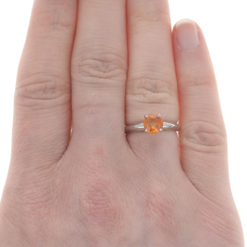 Size: 5
Sizing Fee: Up 4 sizes for $60 or Down 2 sizes for $40

Metal Content: Platinum

Stone Information

Natural Spessartite Garnet
Carat(s): 1.12ct
Cut: Round
Color: Orange

Total Carats: 1.12ct

Style: Solitaire

Measurements

Face Height