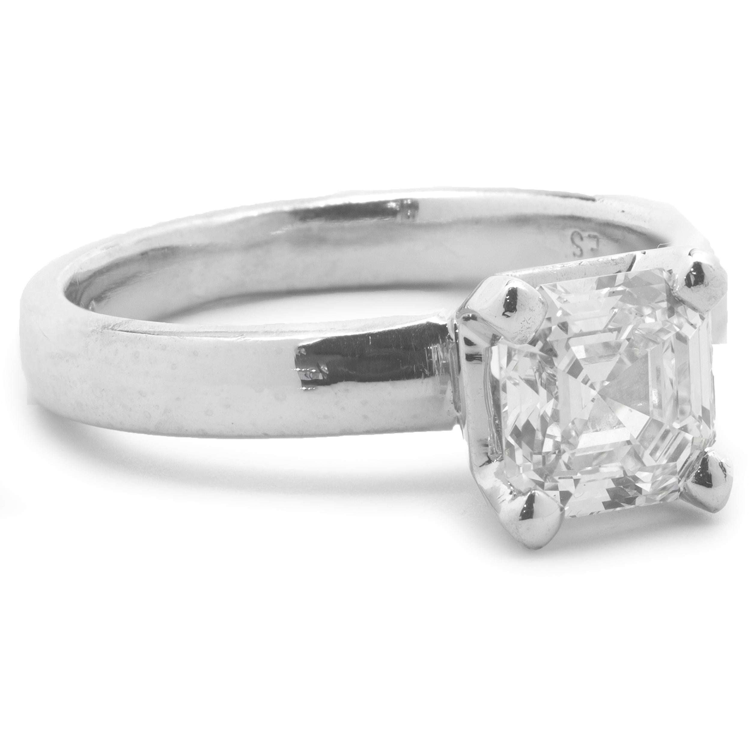 Designer: custom
Material: platinum 
Diamond: 1 square emerald cut = 1.03ct
Color: I
Clarity: VS2
GIA: 14921143
Ring Size: 4.5 (please allow up to 2 additional business days for sizing requests)
Dimensions: ring top measures 6.75mm wide
Weight: 5.61
