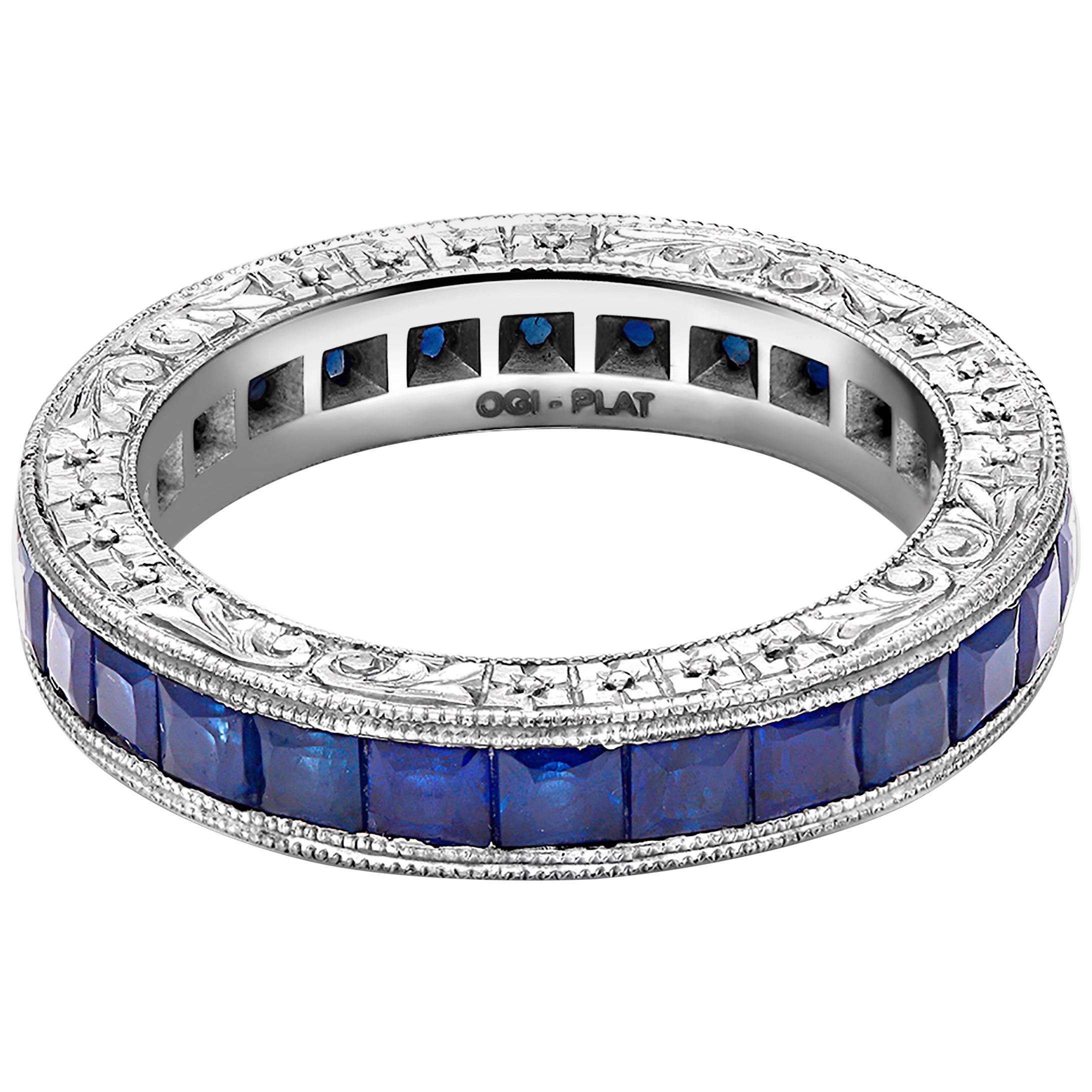 Platinum eternity ring with princess-cut sapphire 
Hand engraved by old master engraver
Sapphires weighing 2.75 carat 
Ring size 5
New Ring
Handmade in the USA
Our team of graduate gemologists carefully hand-select every diamond and gemstone
Our