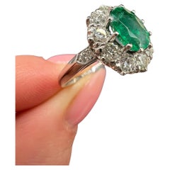 Platinum Stamped, Edwardian Style Emerald 
Diamond Oval Cluster Ring