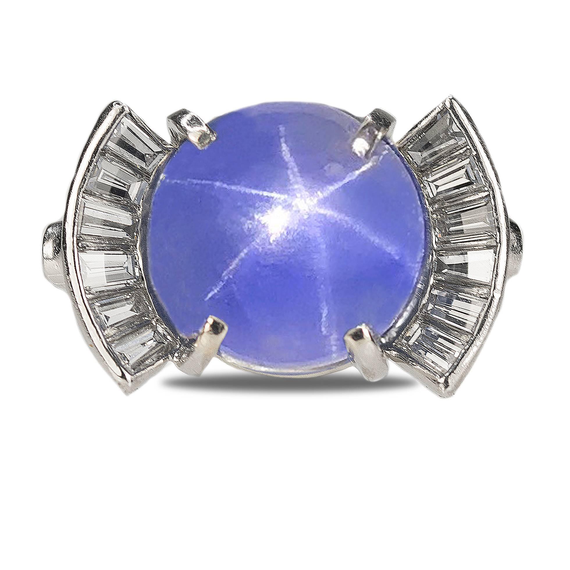 Stunning Platinum Ring with one star sapphire weighing approximately 15.00 carats and twelve baguette diamonds weighing approximately 1.00 carats, 11.25g