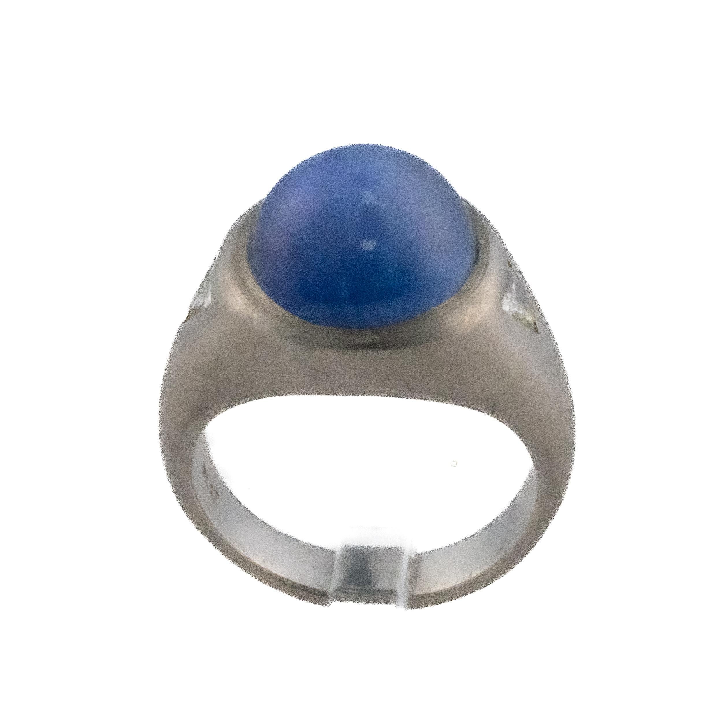 Platinum Star Sapphire with Trillion Cut Side Diamond Solitaire Ring

Description: A magnificent platinum ring featuring a blue star sapphire framed by two trillion cut Diamonds. Creating a timeless and luxurious statement piece with classic