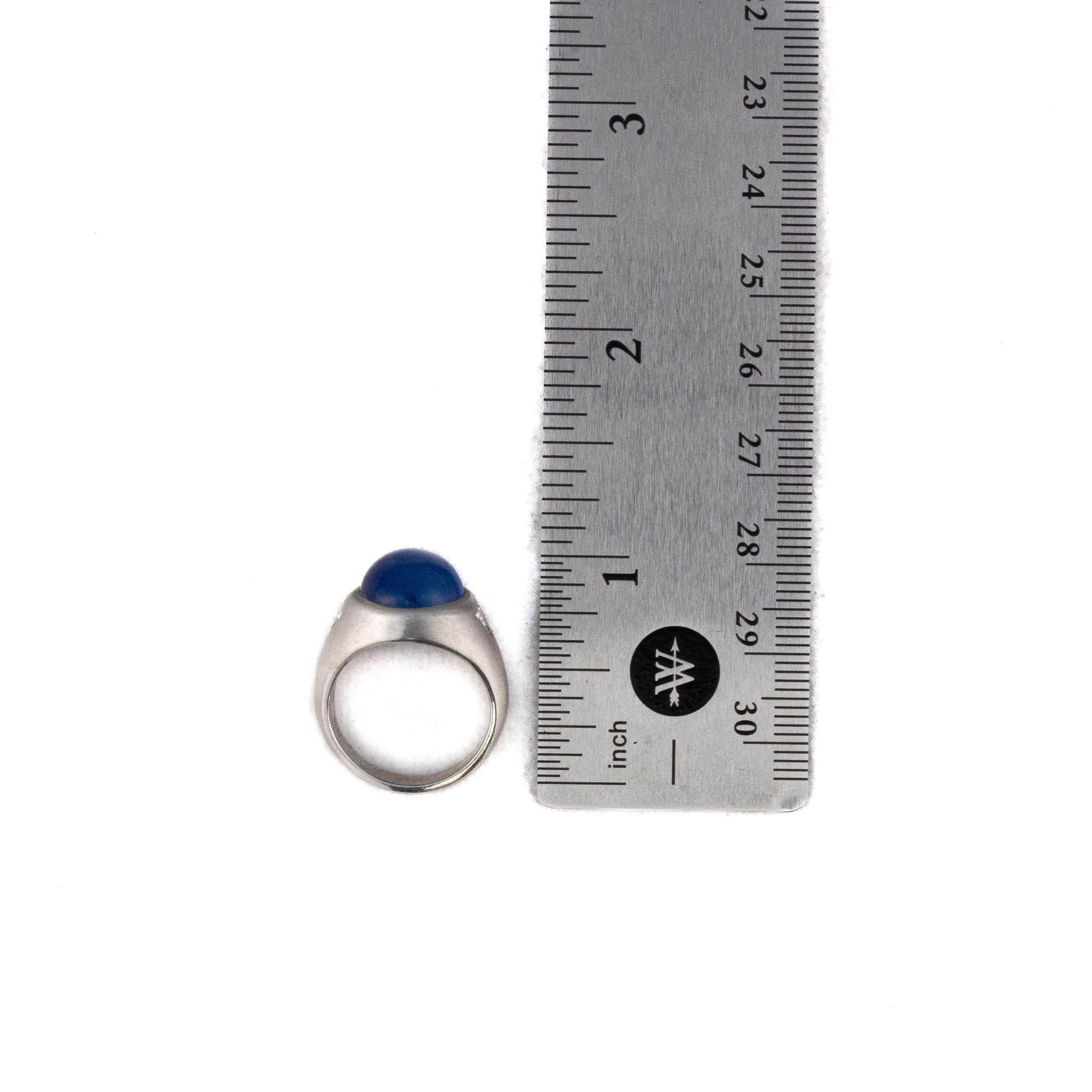 Cabochon Platinum Star Sapphire with Trillion Cut Side Diamond Solitaire Ring For Sale