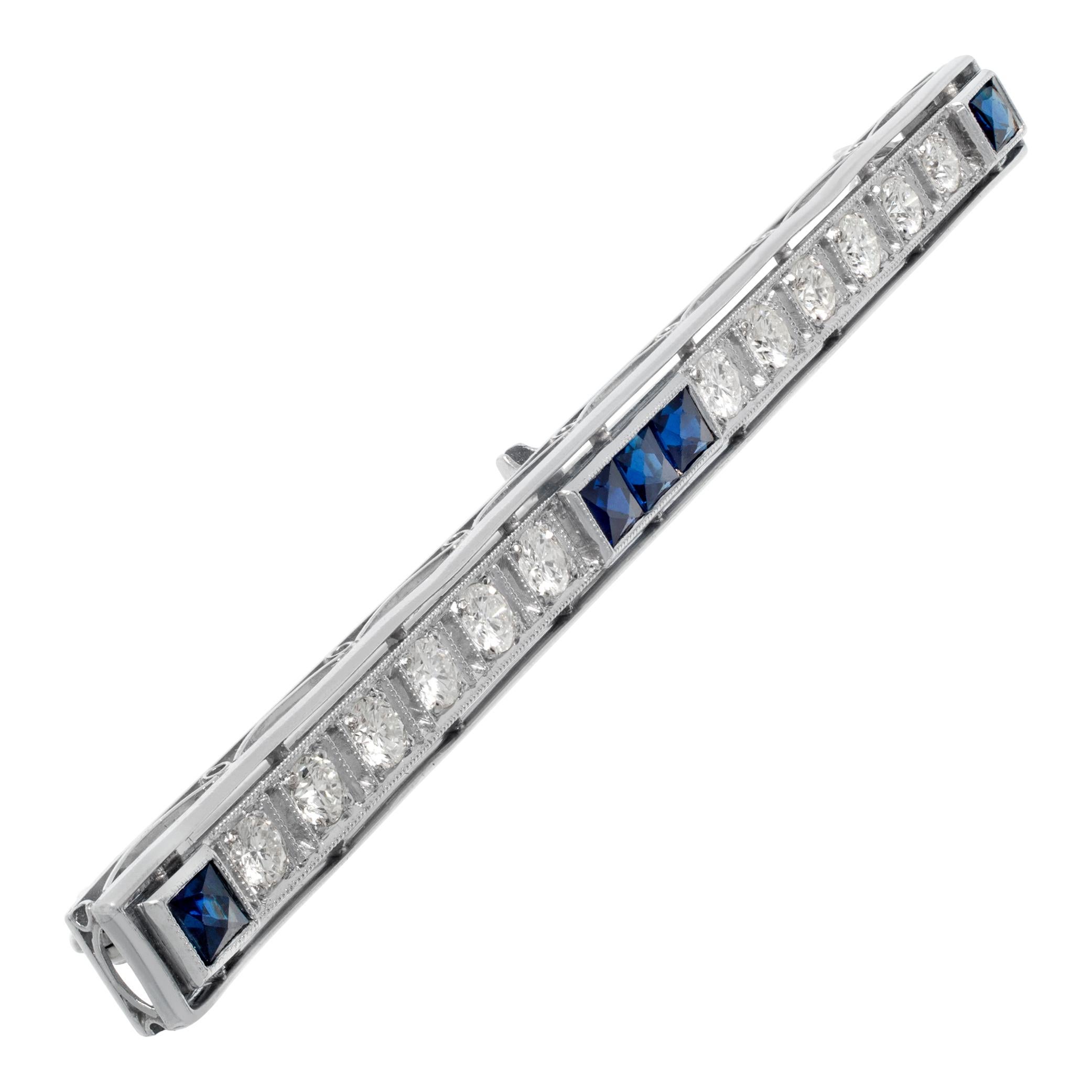 Vintage stick pin in platinum with approximately 1.20 carats in diamonds (G-H color, VS clarity). Five French cut sapphires. 3 inch length.
