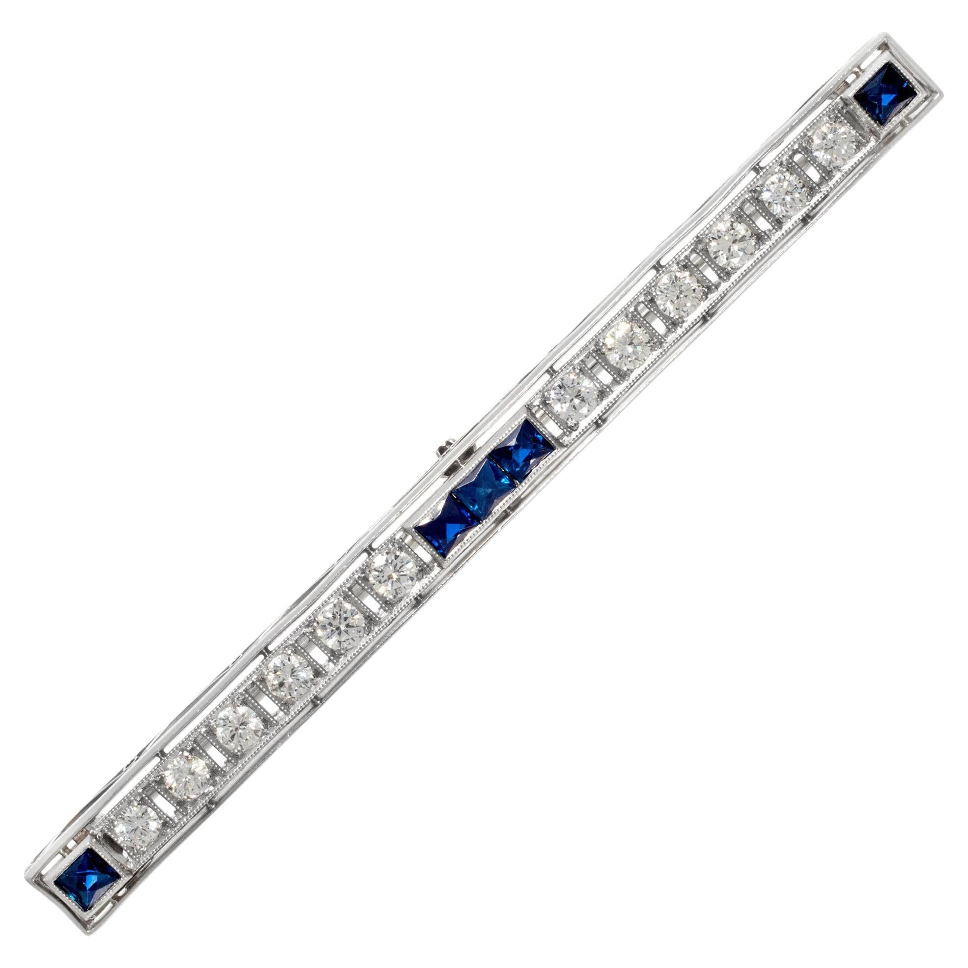 Platinum stick pin with diamonds and five French cut sapphires