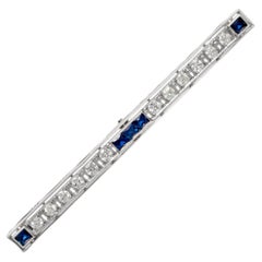 Vintage Platinum stick pin with diamonds and five French cut sapphires