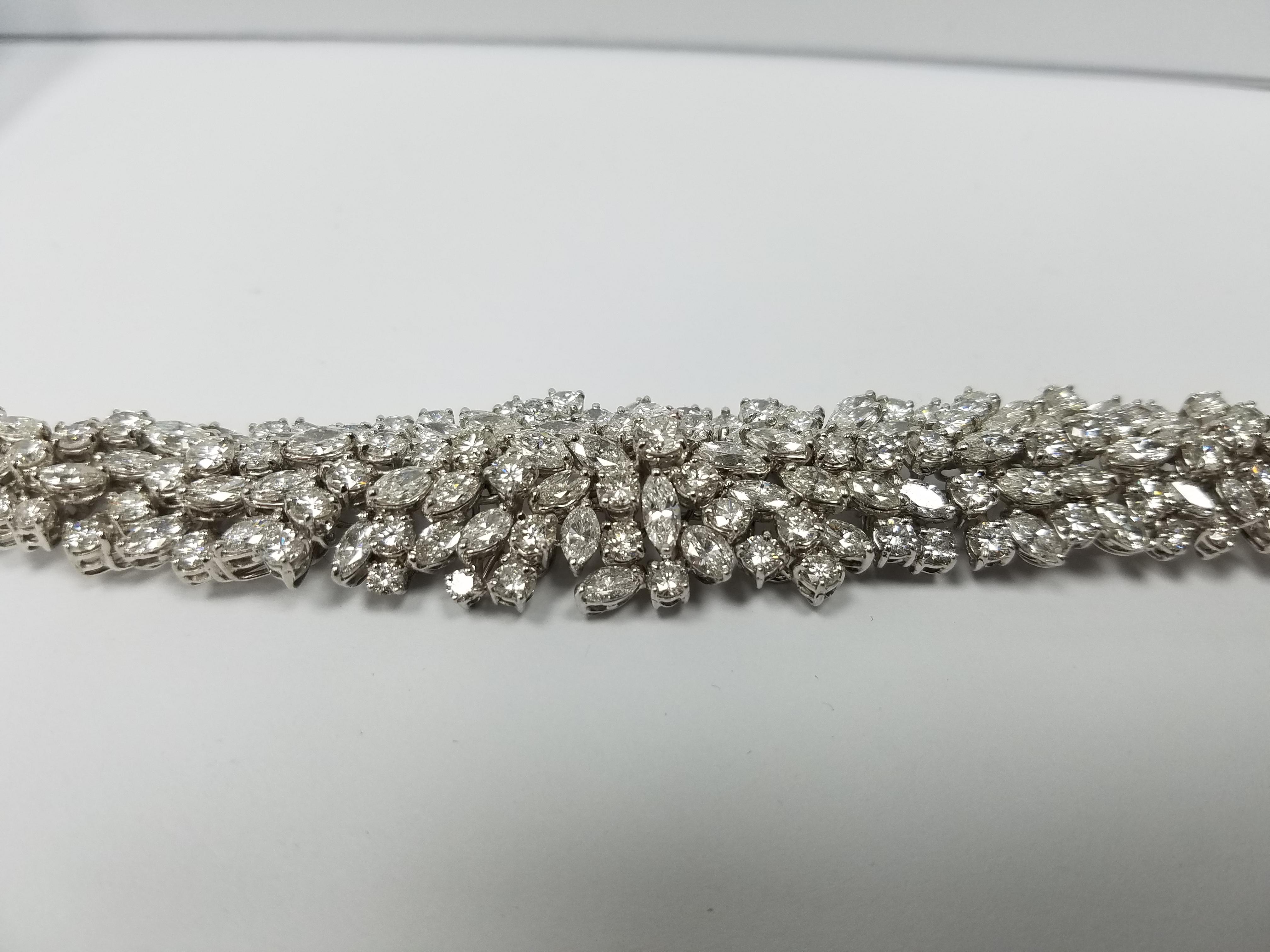 Platinum Stone on Stone Style cluster bracelet with GH+ in color and VS quality white diamonds. Winston Inspired design. aprox 70 carats in diamonds. 