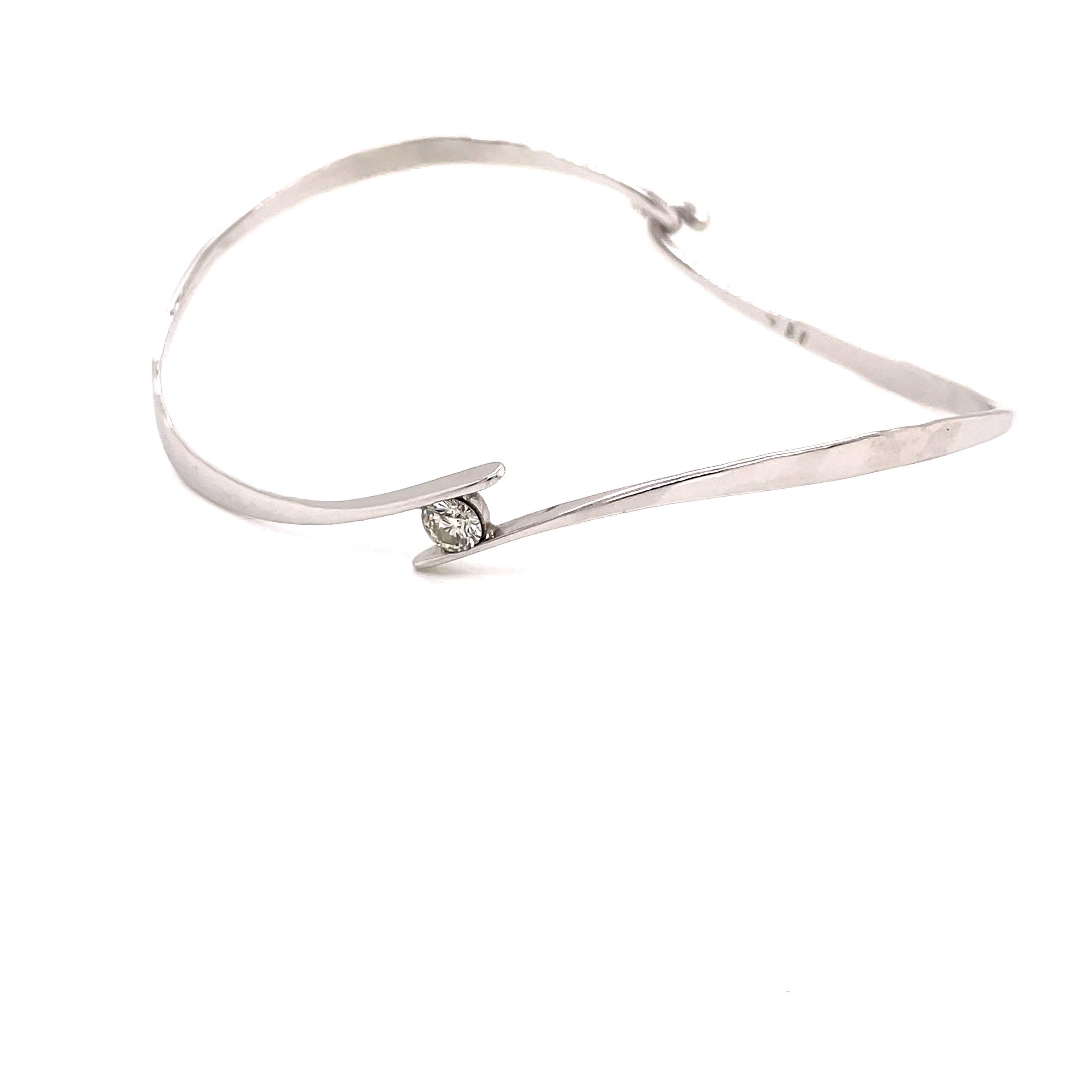 Contemporary Platinum Swirl Bangle Bracelet with .27ct Diamond For Sale