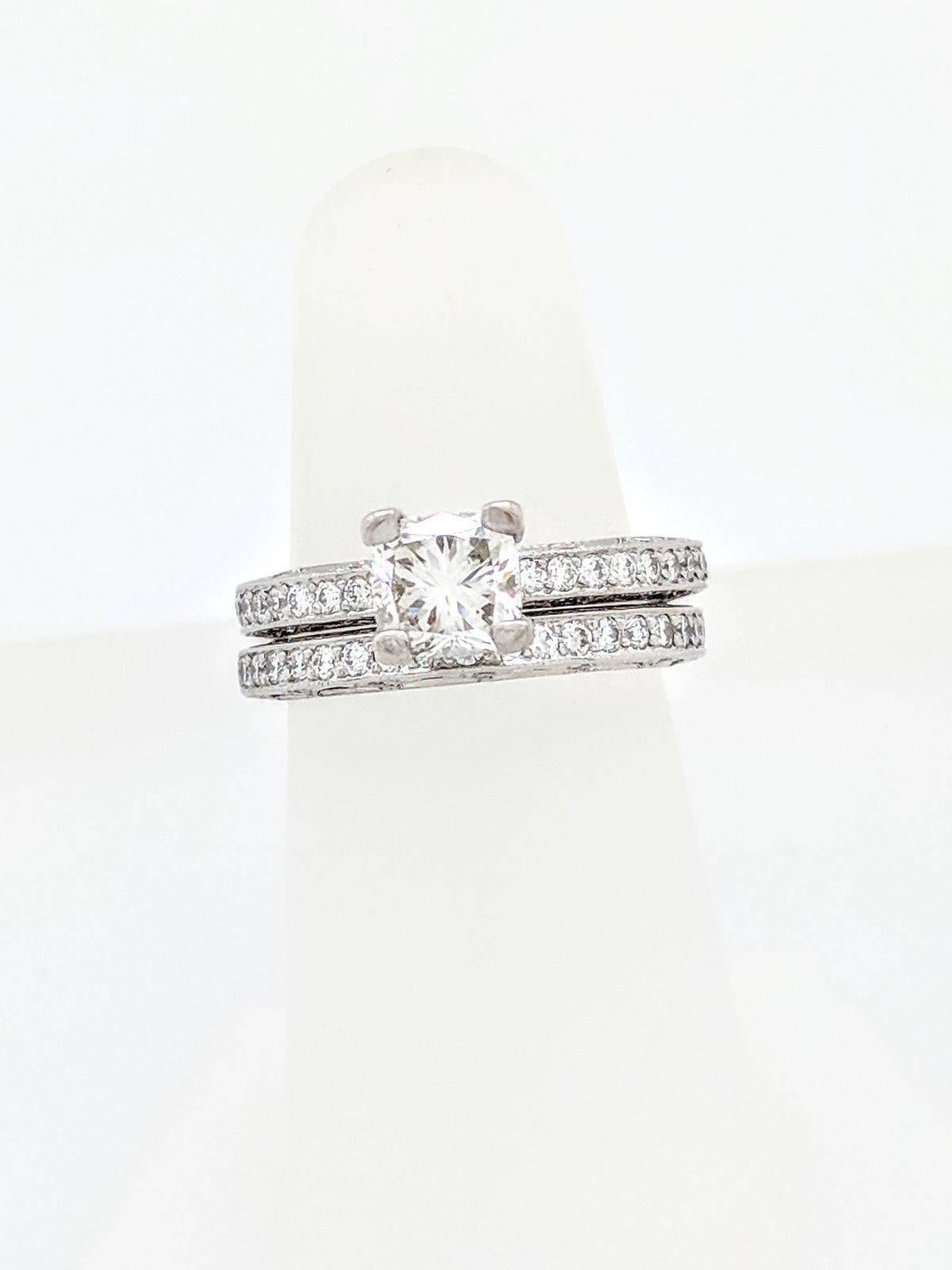 Platinum Tacori 1.05ct Cushion Cut Diamond Engagement Ring with Matching Band SI1/G

You are viewing a beautiful 1.05ct natural cushion cut diamond wedding set. We estimate the diamond to be SI1 in clarity and G color.
The diamond is beautifully