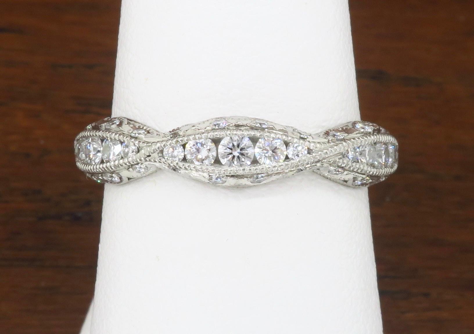 Tacori Platinum Classic Crescent diamond eternity* band made with Round Brilliant cut diamonds.

Gemstone: Diamond
Diamond Carat Weight: Approximately .87ctw
Diamond Cut: Round Brilliant Cut
Color: Average E-G
Clarity: Average VS
Metal: