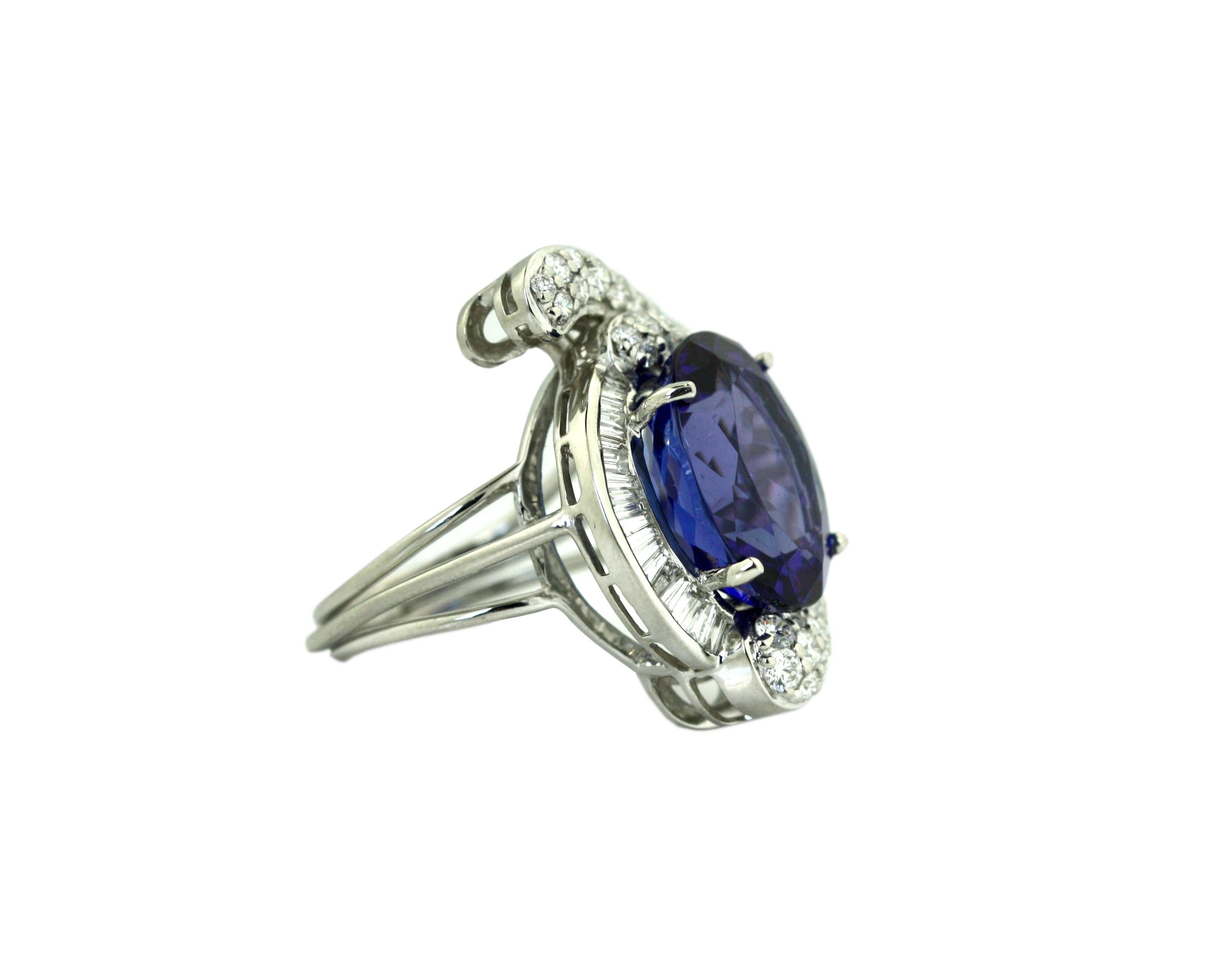 
Platinum, Tanzanite and Diamond Ring
Prong-set with a oval-shaped Tanzanite weighing 14.11 carats, framed by diamonds, size 7 3/4.
﻿Accompanied by GIA Report 5202917842 Stone measurements 16.45 x 13.54 x 9.36mmShape: Oval, Cuttin Style: Crown