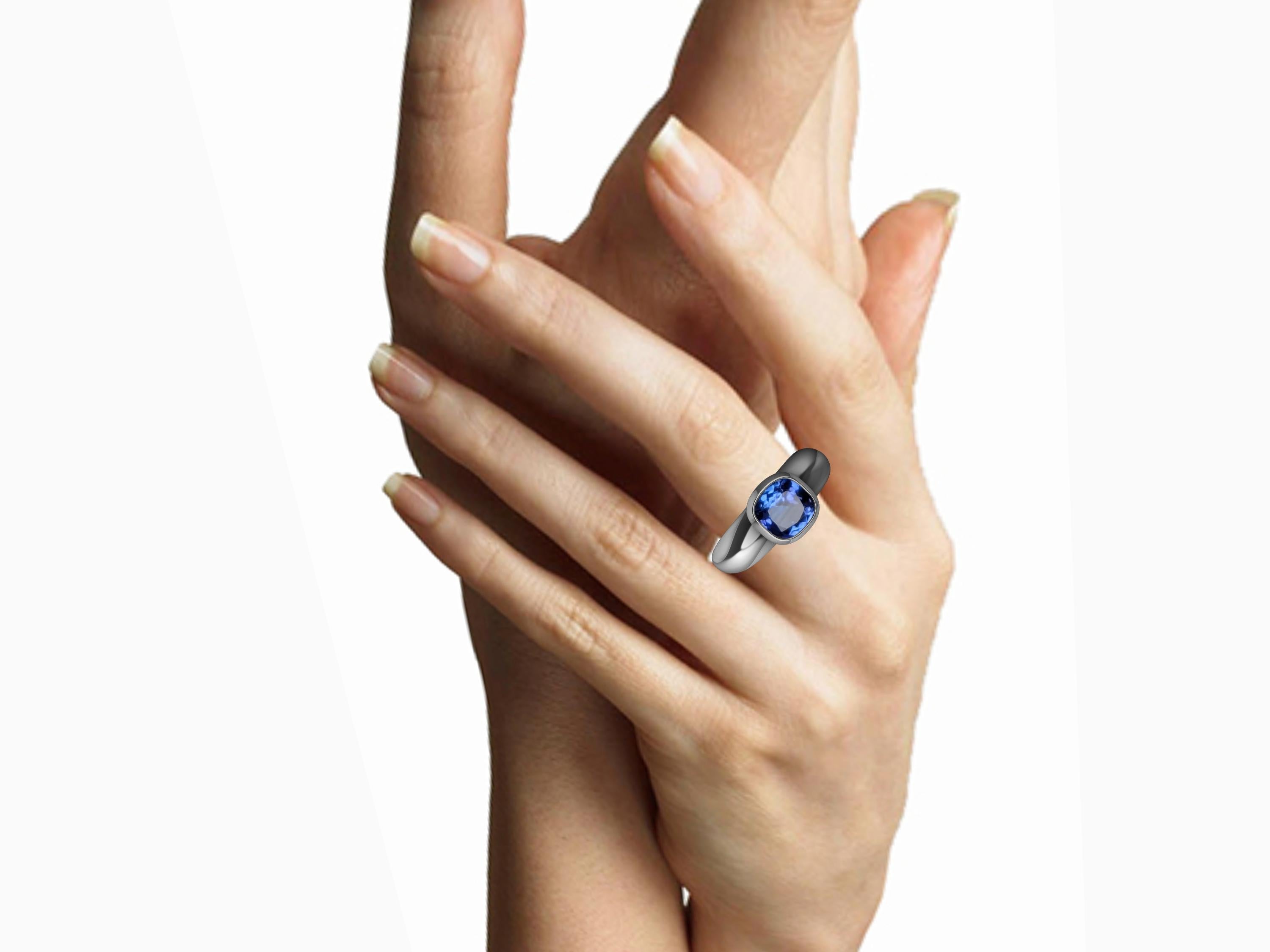 Platinum Tanzanite Sculpture Ring, Tiffany Designer, Thomas Kurilla is really a sculptor at heart.  Keeping it simple. This idea of simplifying your life can go into a lifestyle of design also. 7 X 7 mm cushion cut tanzanite in bezel setting. Call