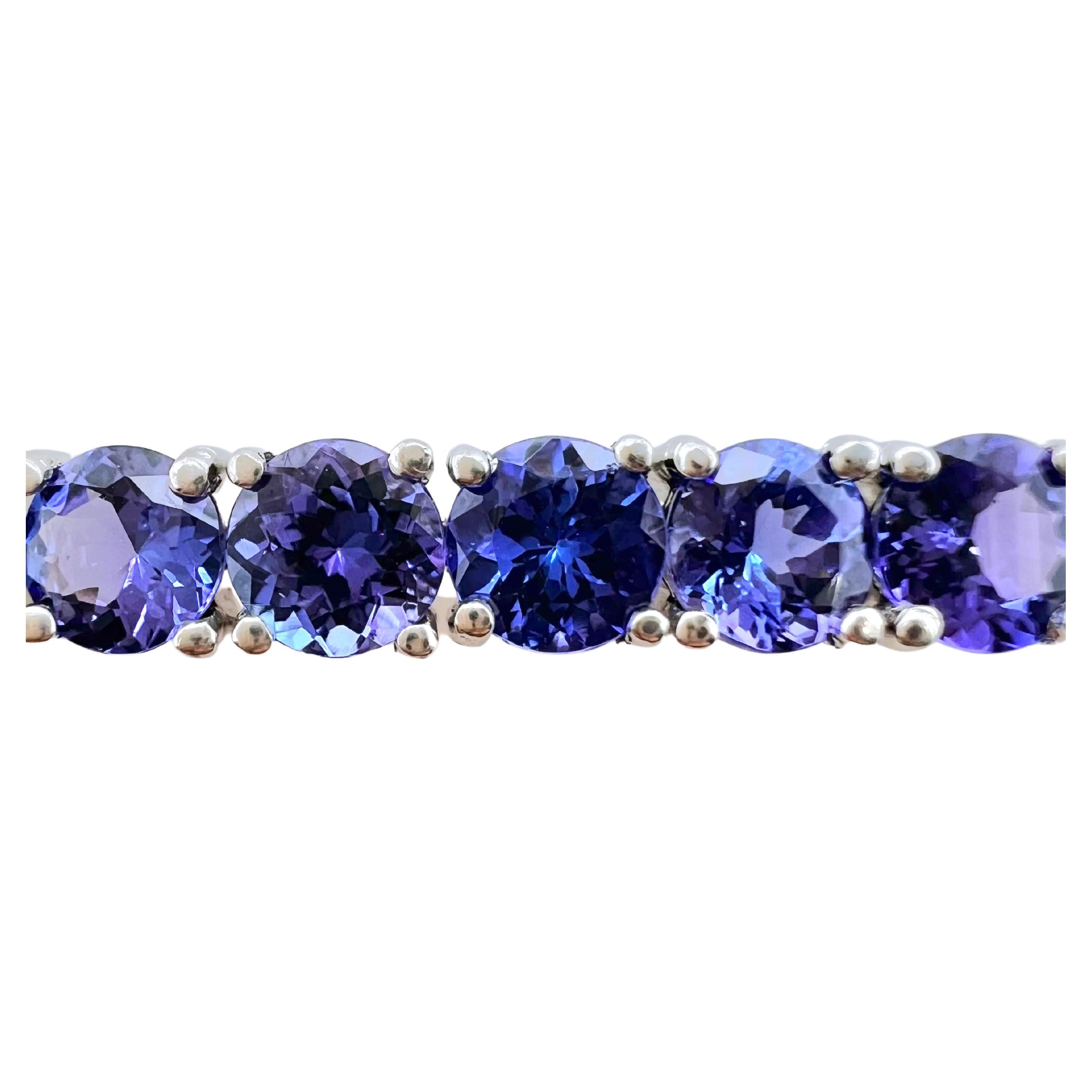This Tanzanite bracelet is absolutely amazing! A straight line of round cut Tanzanites that just exudes a gorgeous
purple color for your wrist.  The brilliance and fire of the Tanzanites absolutely shows on this platinum setting.  The
time to