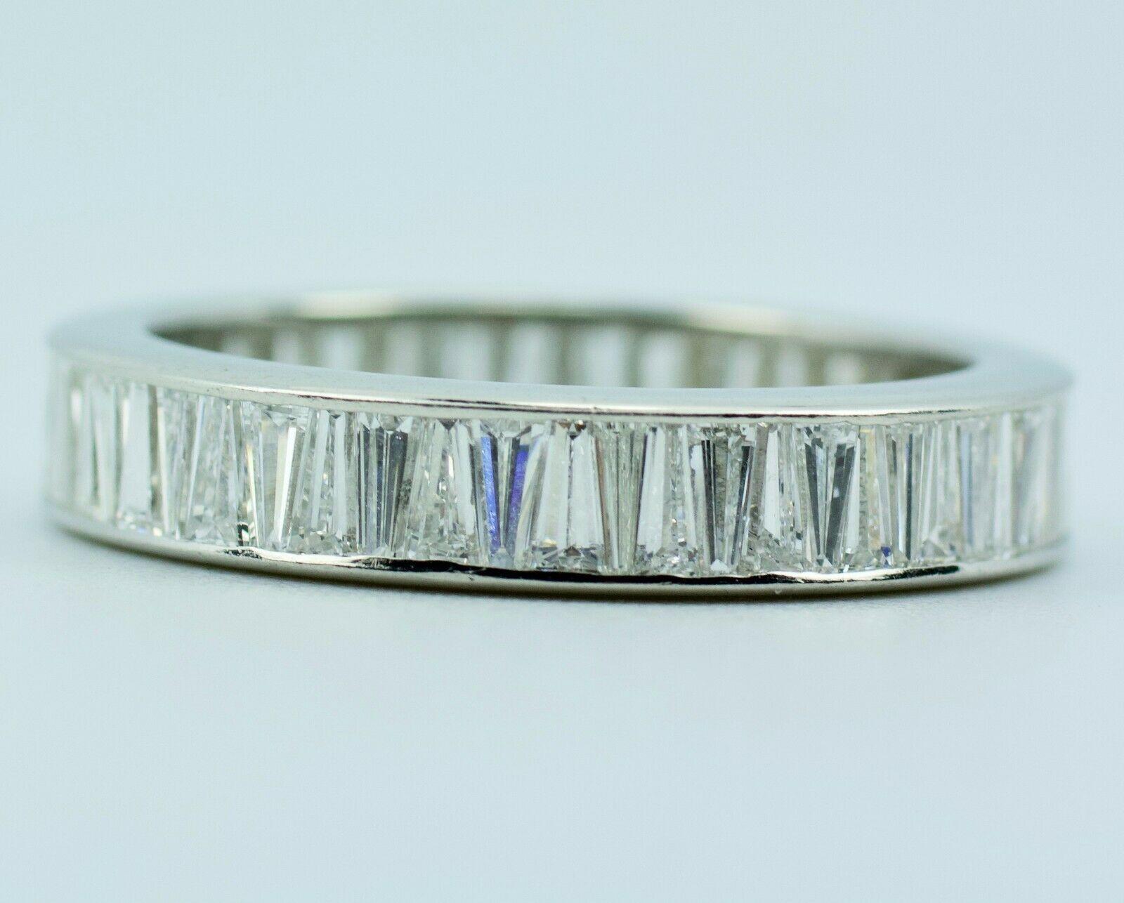 Platinum White Baguette Cut Diamond Eternity Band
Ring Size 7.75
5 Grams
60 White Baguette Diamonds 3 Carats Total Weight
Color: D-F
Clarity: Vs1

This is a beautiful diamond band that shows off these white baguette diamonds. They are tapered