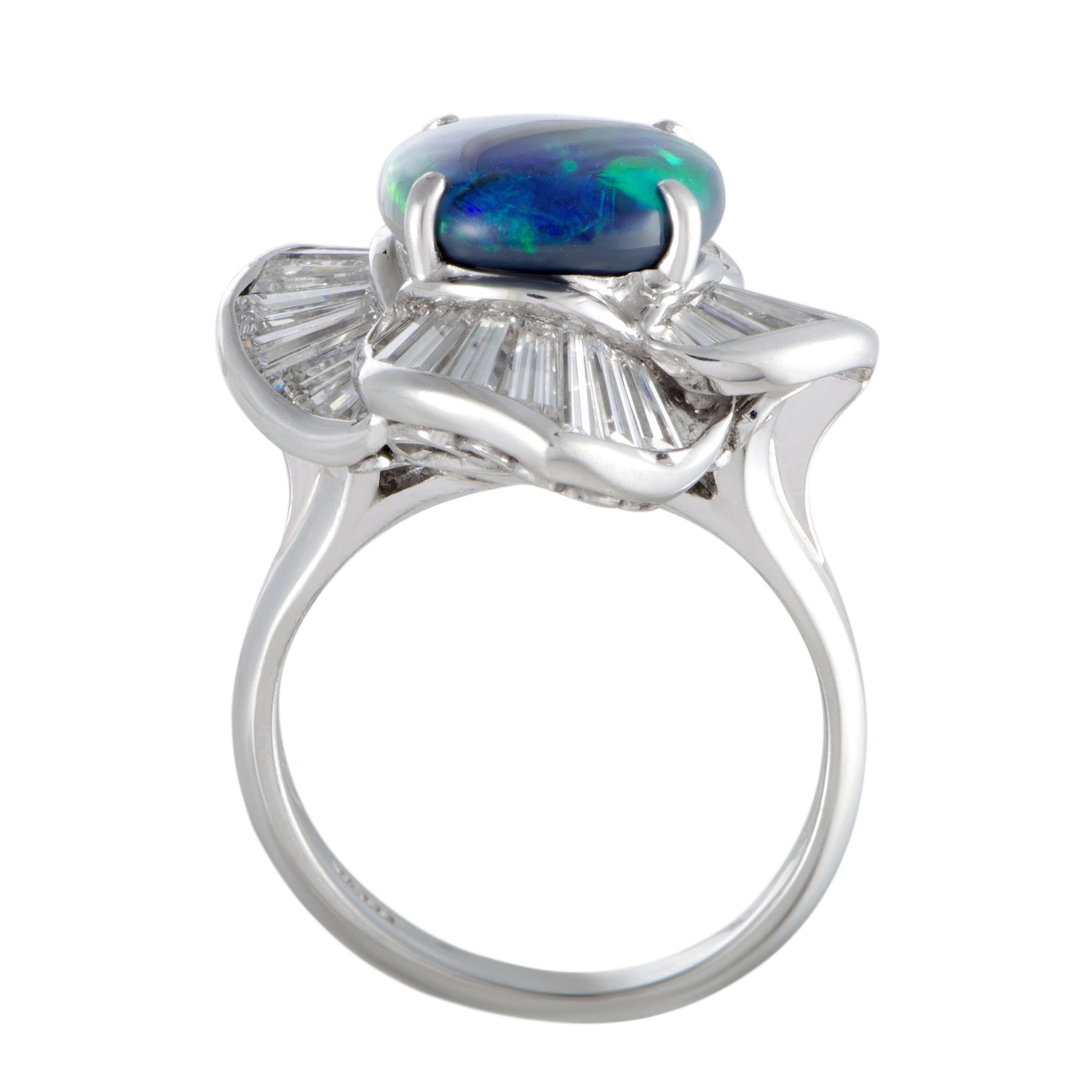 This exceptional ring is presented with a splendidly elegant design and majestic gemstone décor. Beautifully made of luxurious platinum, the ring is set with 2.69 carats of diamonds and with an eye-catching opal that weighs 3.75 carats.
Ring Top